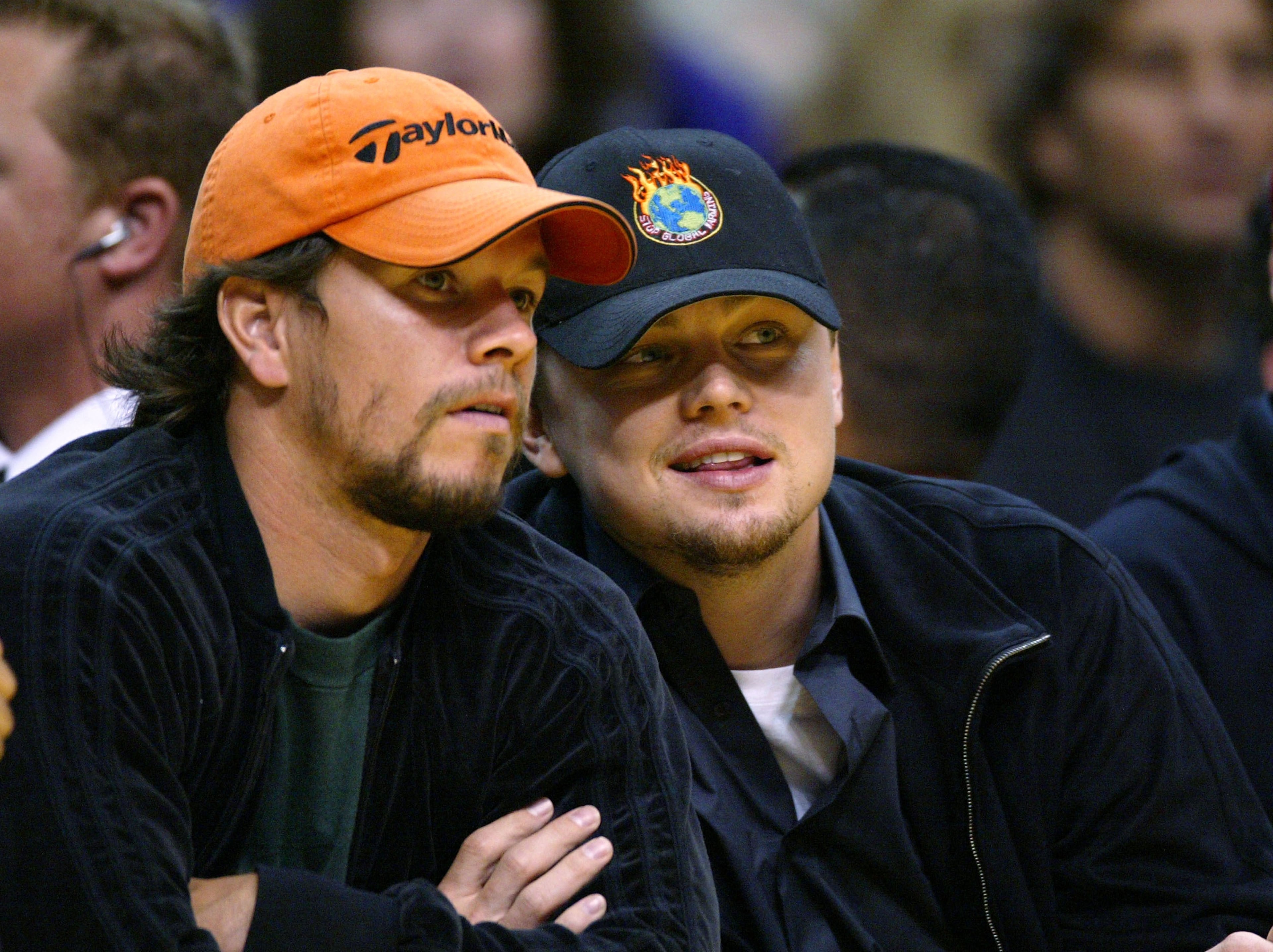 Actors Mark Wahlberg (left) and Leonardo DiCaprio attend the game between the Los Angeles Lakers and the Minnesota Timberwolves on March 26, 2004, in Los Angeles.