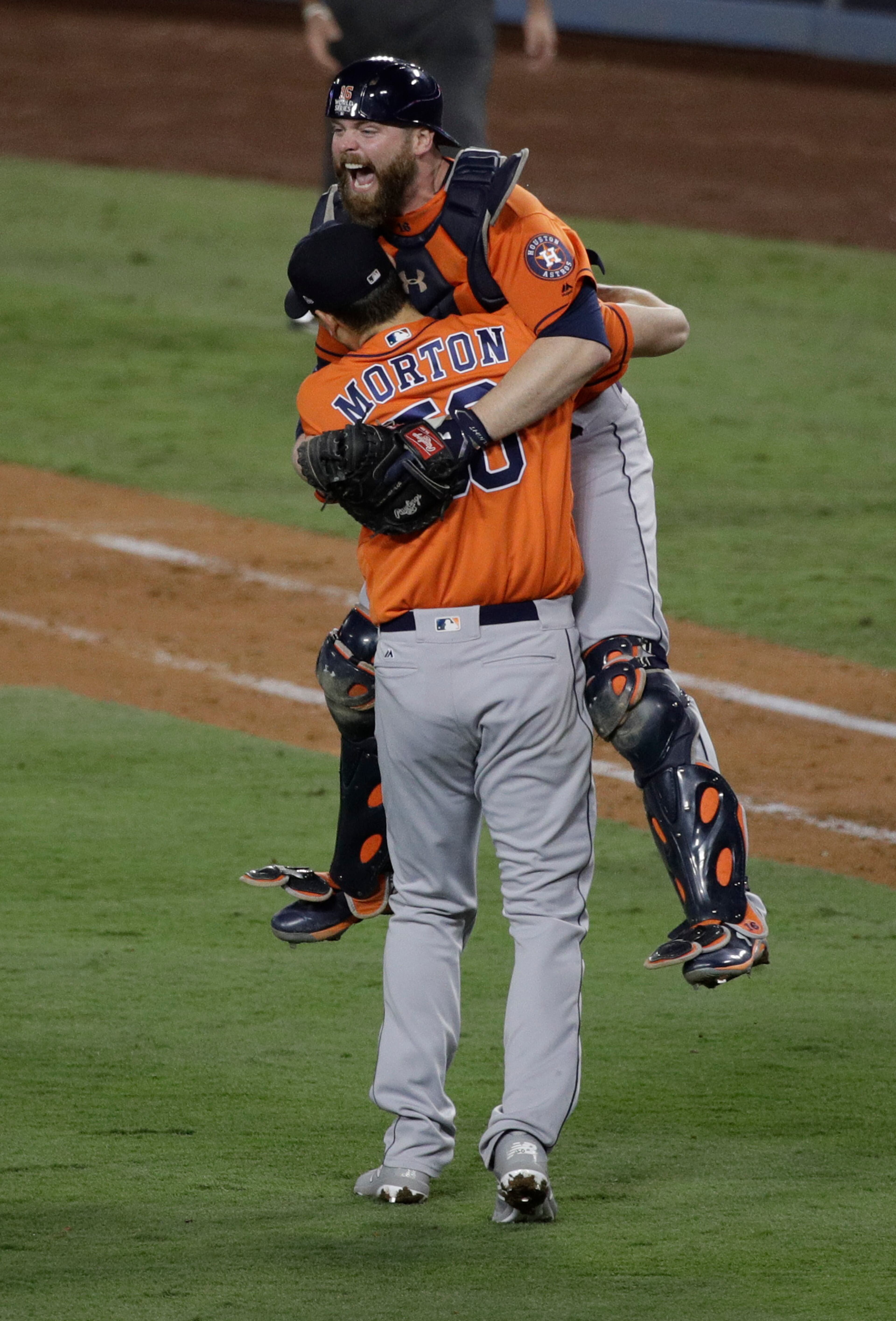 Houston Astros catcher Brian McCann and pitcher Charlie Morton celebrate after win against the Los Angeles Dodgers in Game 7 of baseball's World Series Wednesday, Nov. 1, 2017, in Los Angeles. The Astros won 5-1 to win the series 4-3. (AP Photo/Jae C. Hong)