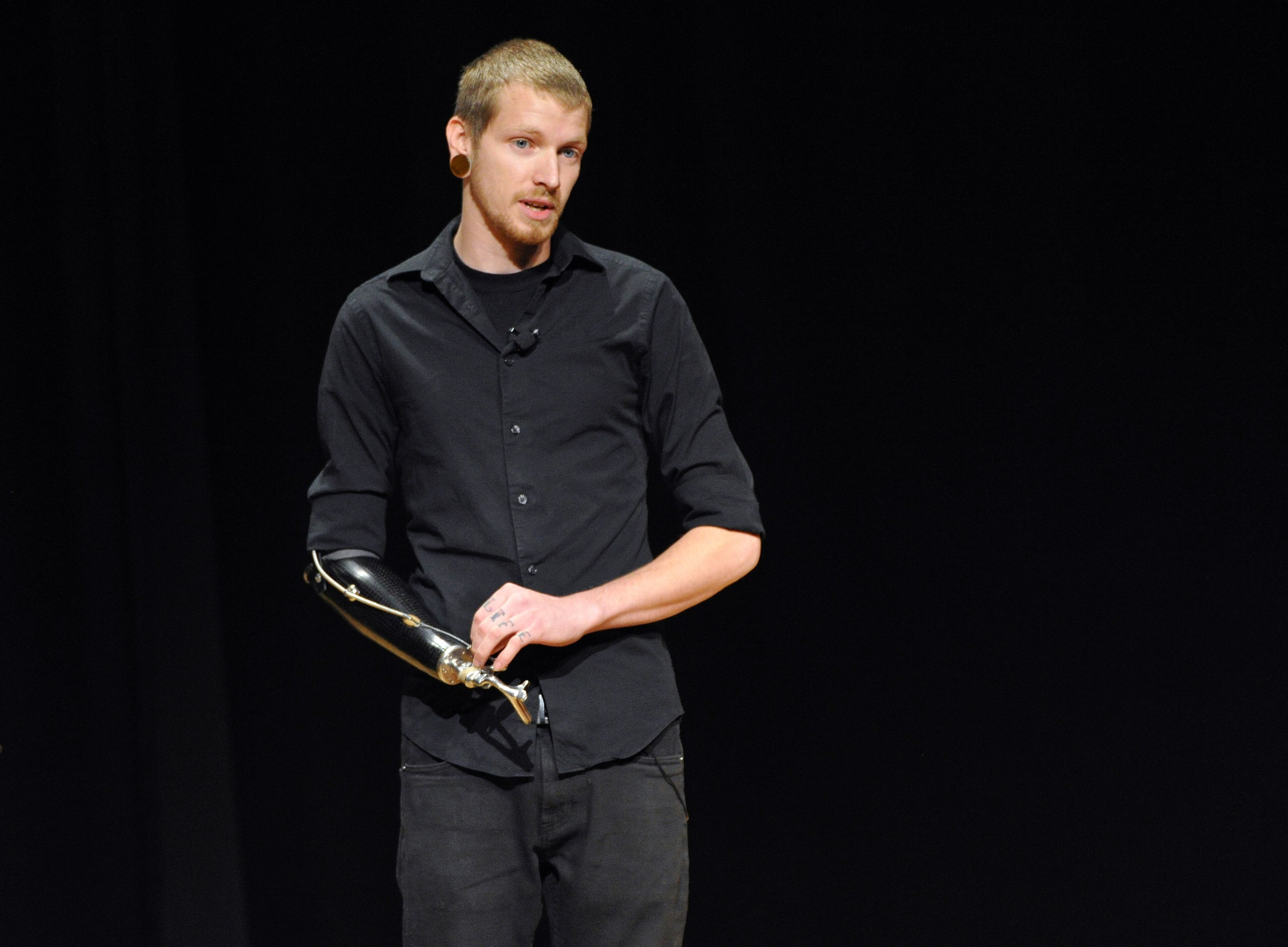 Jason Barnes, a drummer who lost his right hand in an accident, tells his personal story during a Kennesaw State University concert on Saturday March 21, 2014 in Kennesaw, Ga. David Tulis / AJC Special