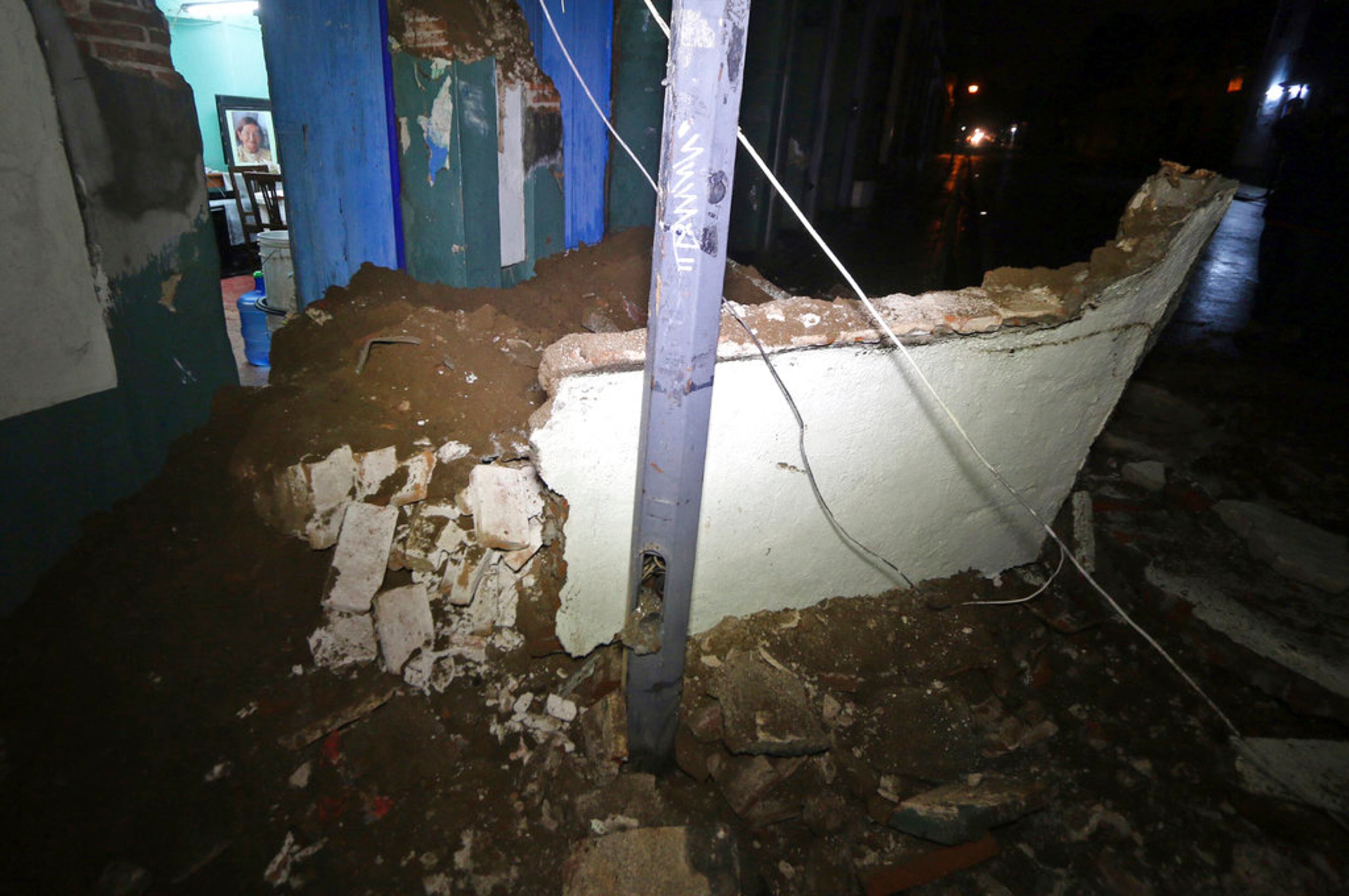 Debris from a collapsed wall sits in Oaxaca, Mexico, after an earthquake early Friday, Sept. 8, 2017. A massive 8-magnitude earthquake hit off the coast of southern Mexico late Thursday night, causing buildings to sway violently and people to flee into the street in panic as far away as the capital city.(AP Photo/Luis Alberto Cruz)