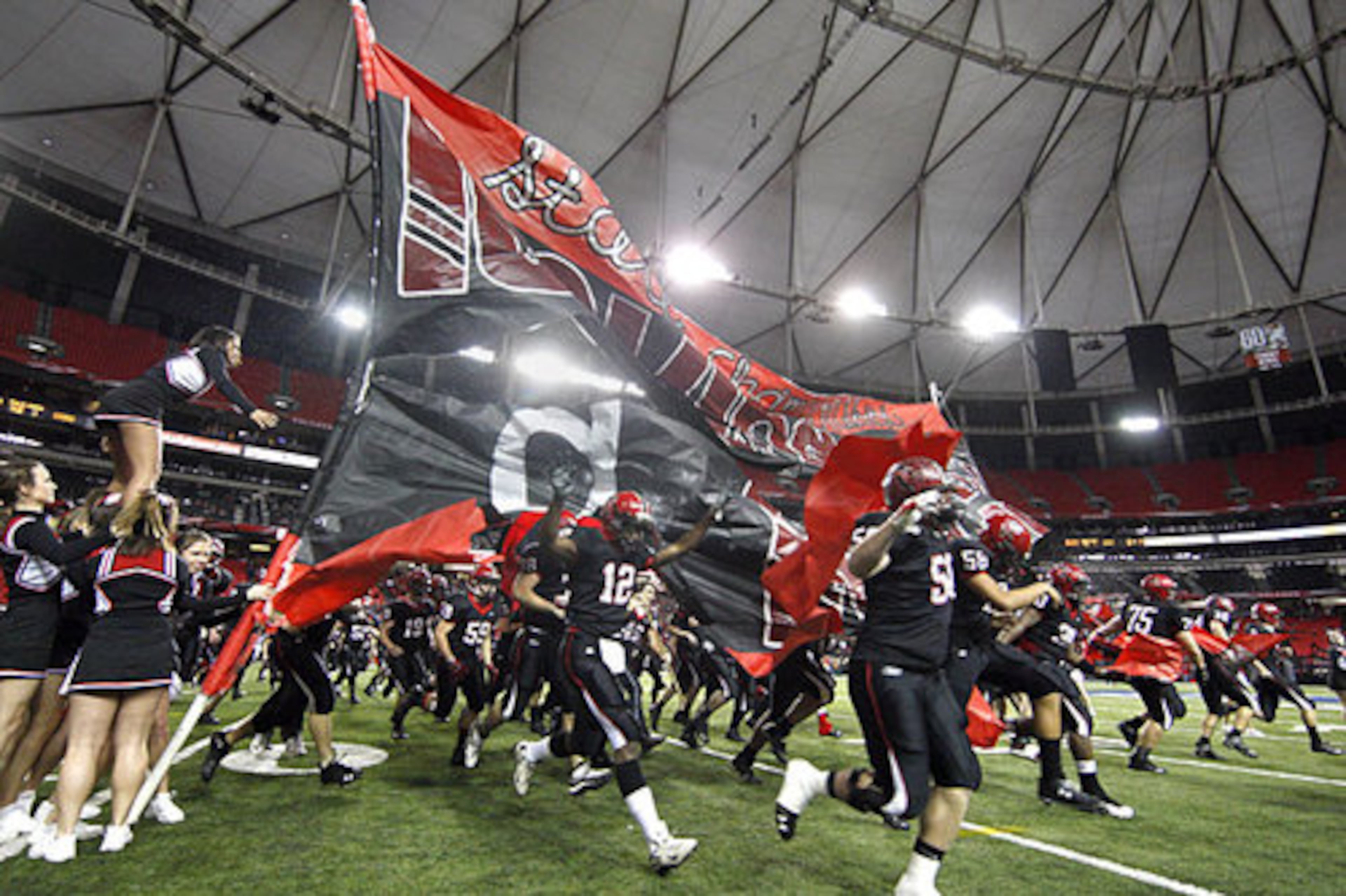 Here comes the Flowery Branch Falcons, as they storm onto the Georgia Dome field for Saturday's AAA state championship game agaisnt Cairo.