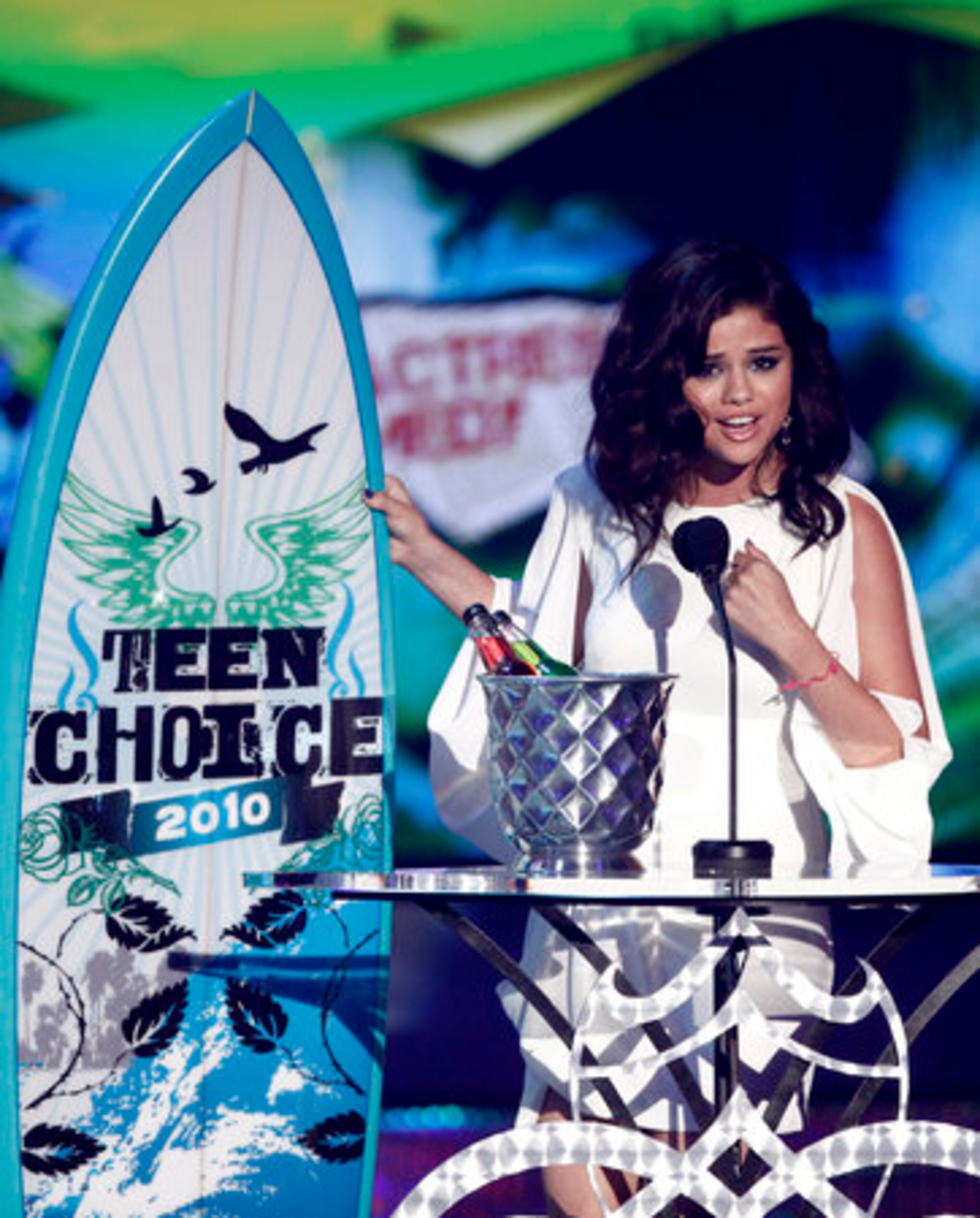 Selena Gomez accepts an award.