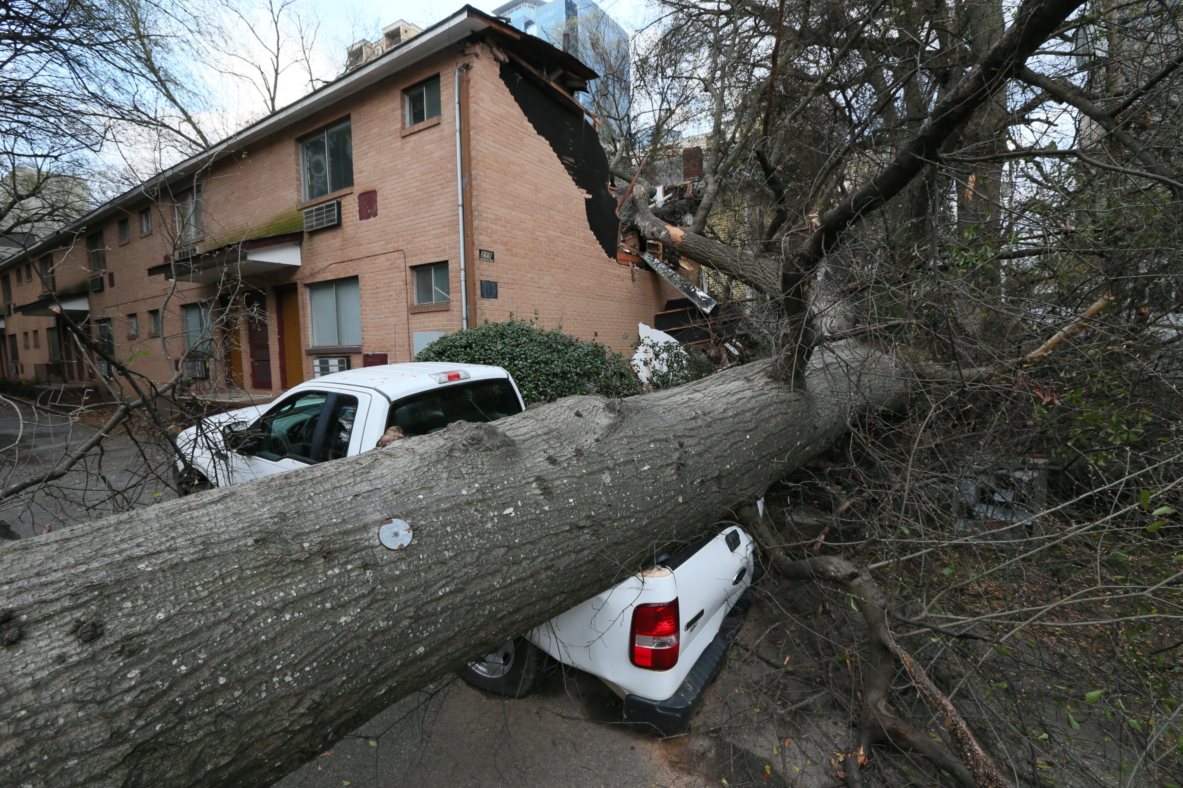West of Piedmont on 13th Street, a huge tree fell, crushing a truck and part of an abandoned apartment complex shortly after noon Sunday. No injuries were reported. The strong cold front that brought rain to metro Atlanta on Sunday ushered in another round of unseasonably cold weather for the first Monday of spring. Temperatures before daybreak were mostly in the mid- to upper 30s, but winds gusting to near 40 mph dropped the wind chill to the upper 20s. A wind advisory was in effect for most of Georgia until 6 p.m. Monday.