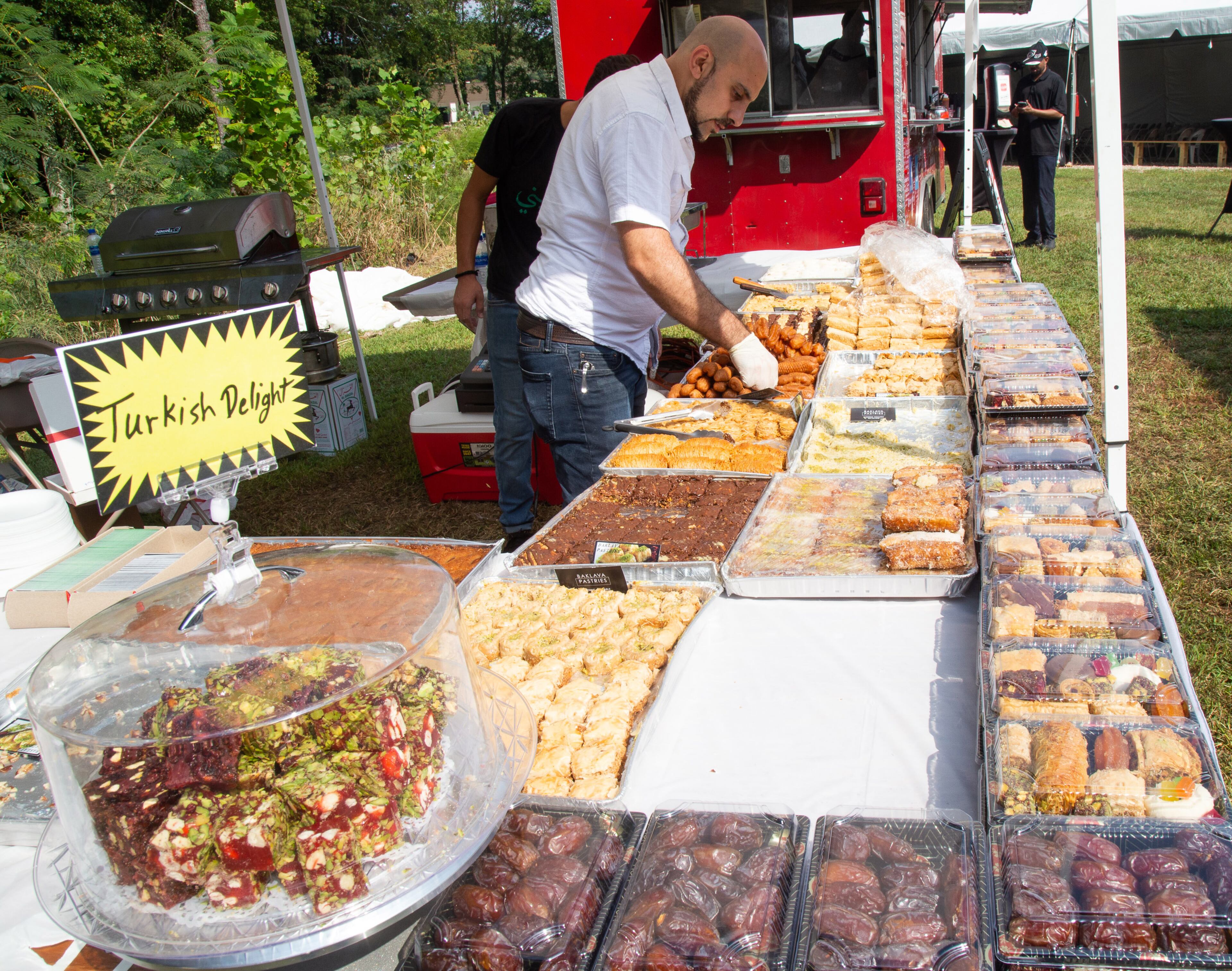 Firas Taslaq from Baklay Pastries prepares his pastries at the beginning of the 14th annual Atlanta Arab Festival at the Alif Institute on Sunday, September 15, 2019. STEVE SCHAEFER / SPECIAL TO THE AJC