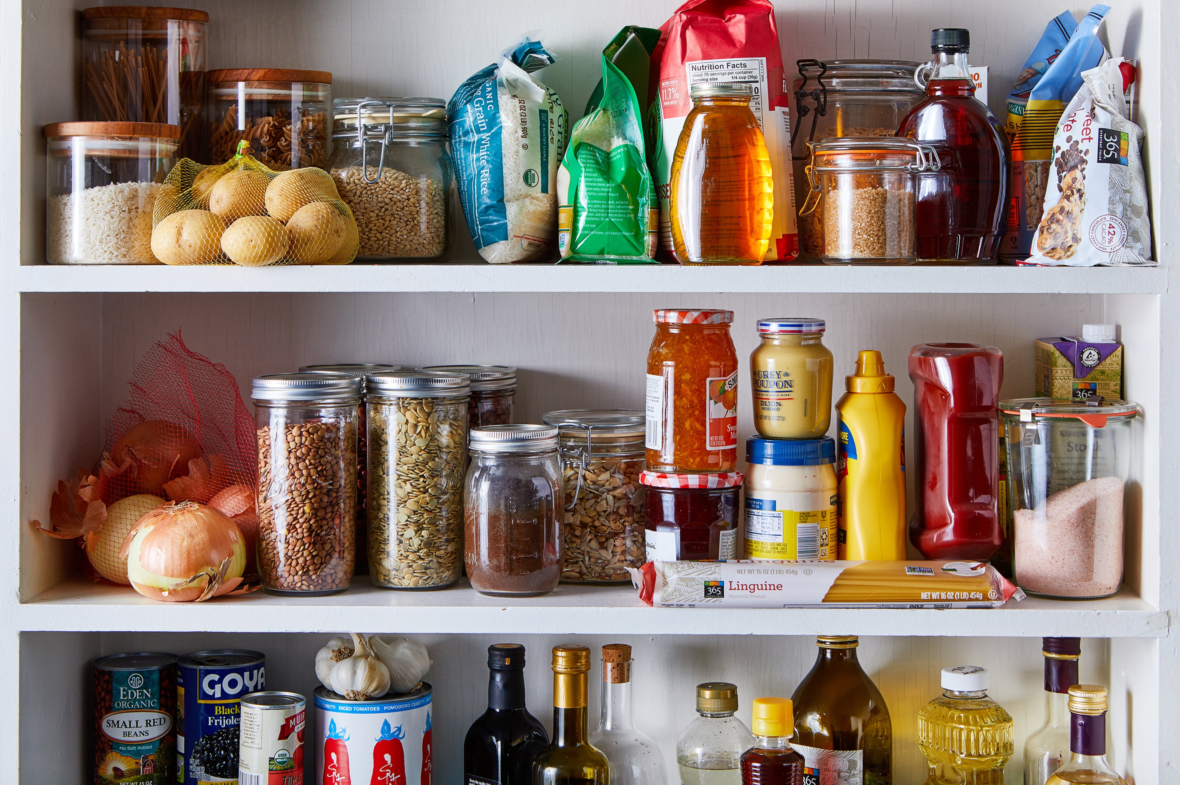 A pantry with many ingredients on the shelves. Prop Stylist: Kristine Trevino. (Julia Gartland/The New York Times)