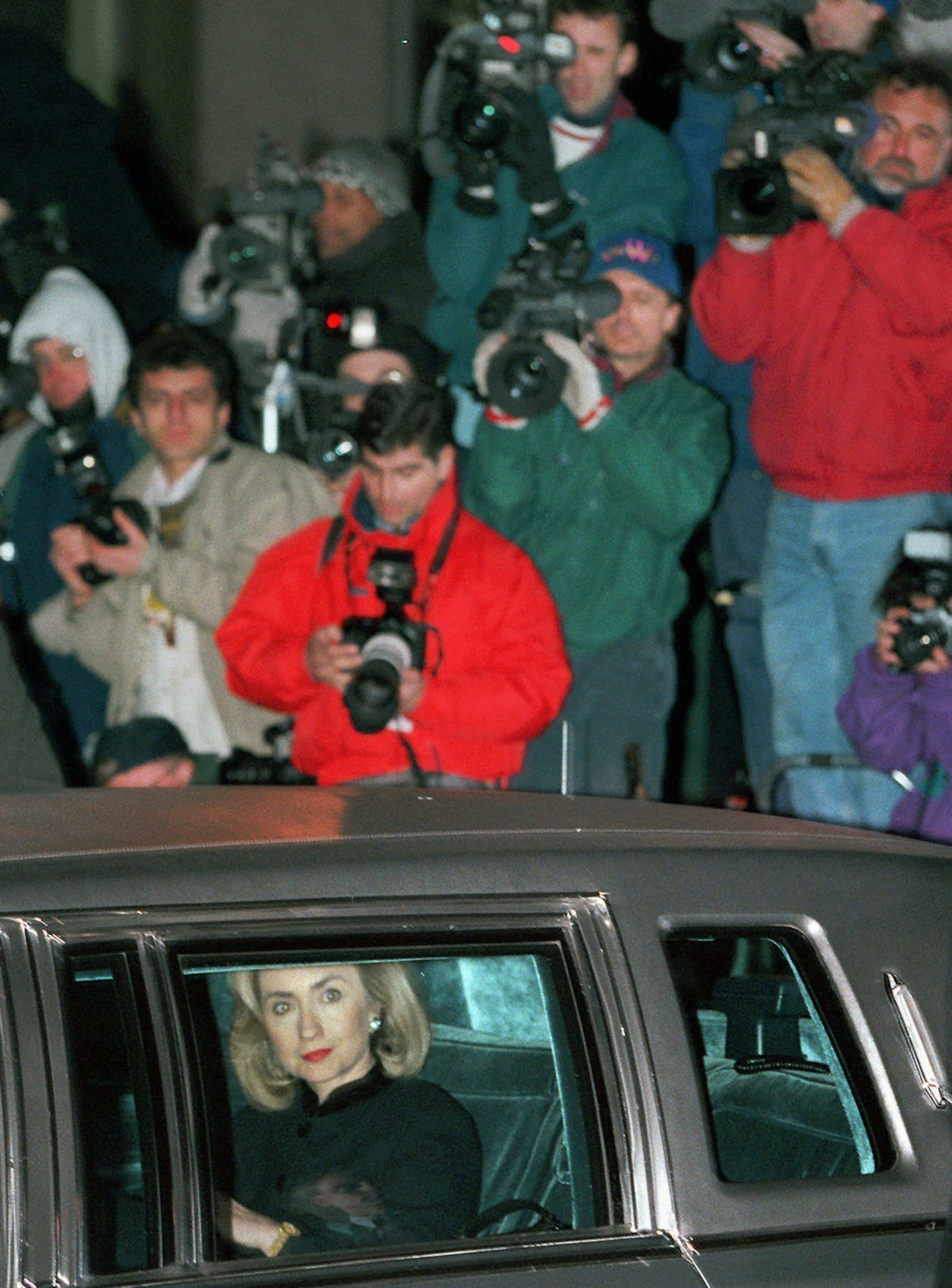 In this Friday, Jan. 26, 1996 file photo, first lady Hillary Clinton leaves U.S. District Court in Washington for the White House after testifying before a grand jury investigating the Whitewater scandal. Clinton testified for about four hours in secret Friday to a grand jury that must decide whether criminal charges are warranted in the disappearance, and then rediscovery, of her long-sought law firm billing records. (AP Photo/Mark Wilson)