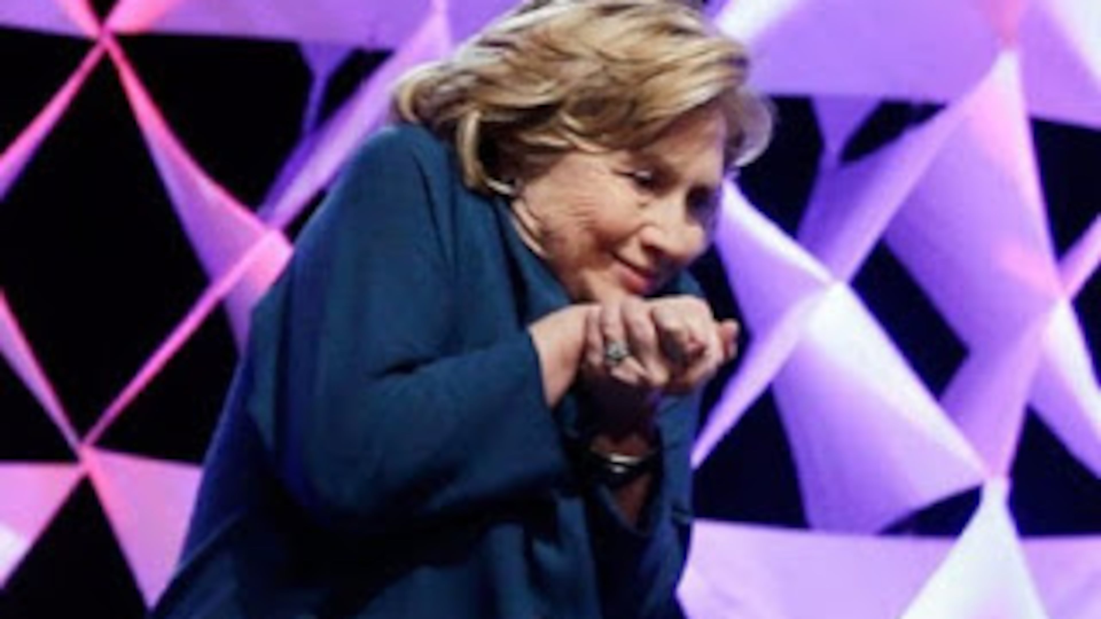 No, this is not a picture of Hillary Clinton having a seizure, although it has been used to suggest such a thing. In reality, she is ducking from a shoe thrown at her in 2014 by a mentally ill woman.
