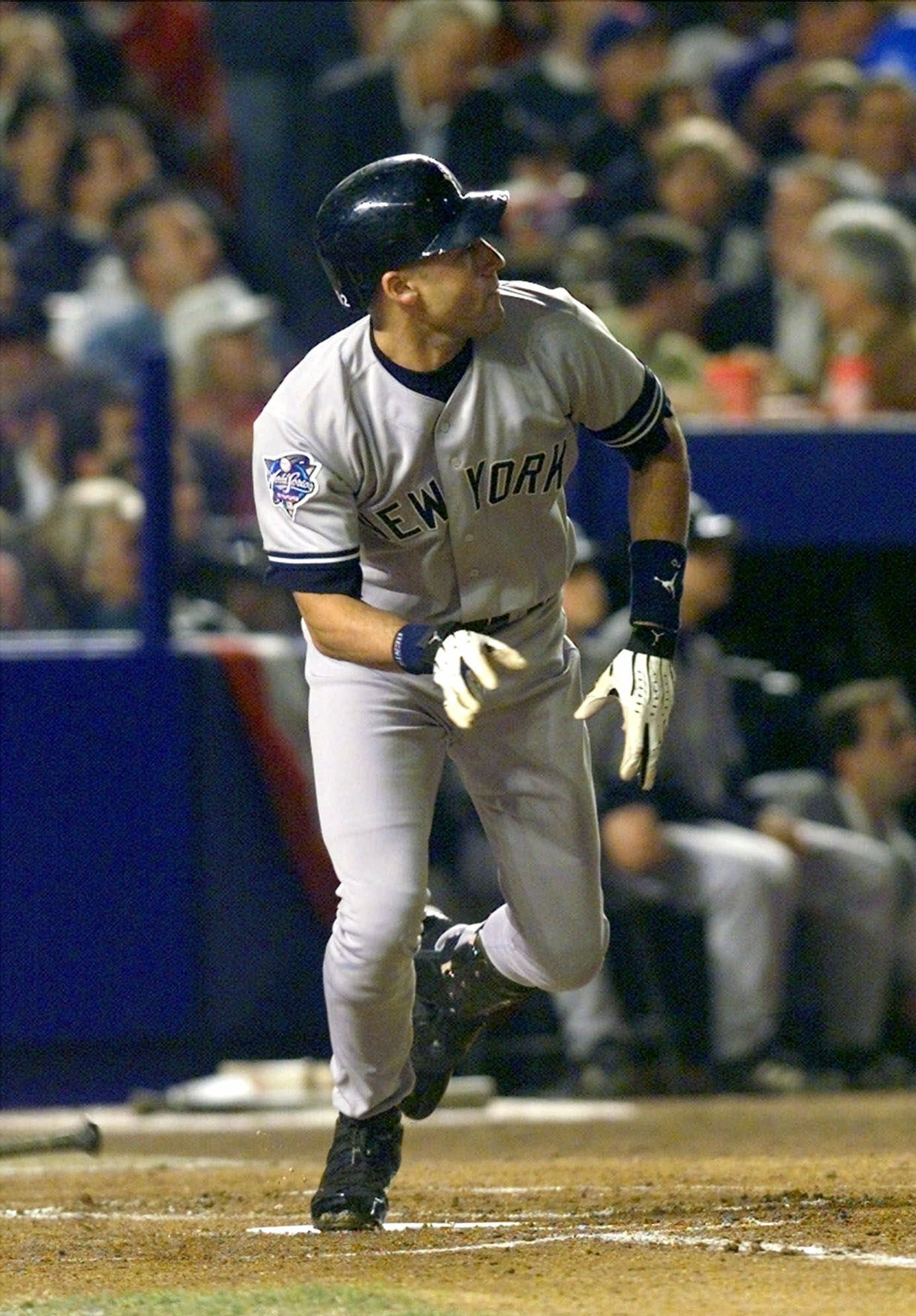 FILE - In this Oct. 25, 2000, file photo, New York Yankees' Derek Jeter watches his solo home run in the first inning of Game 4 of the World Series against the New York Mets at Shea Stadium in New York. Yankees manager Joe Torre moves Jeter up to the leadoff spot for Game 4 and he stuns everyone with a home run on the first pitch of the night from Bobby Jones. (AP Photo/Charles Krupa, File)