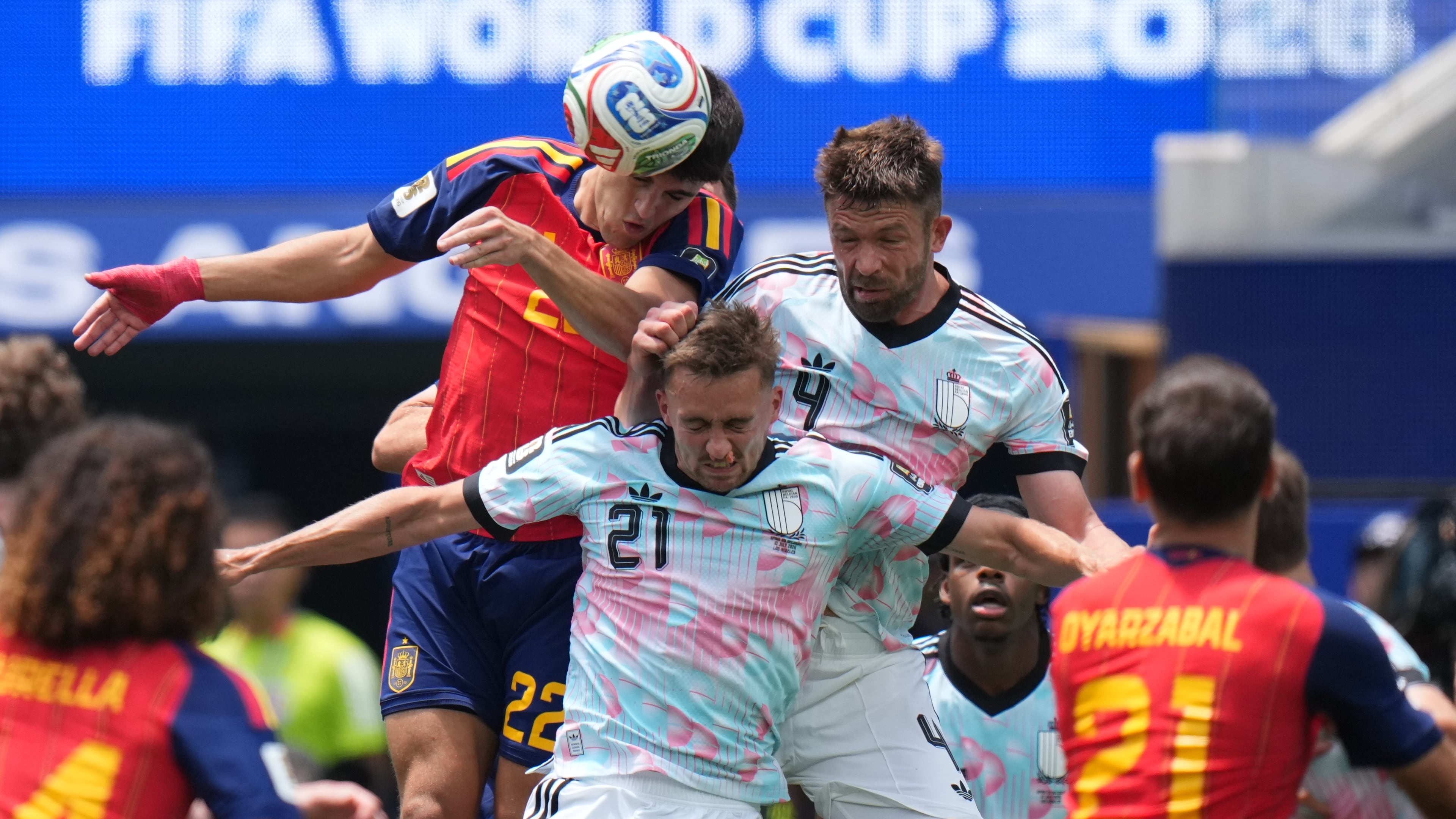 Spain's Pau Cubarsi goes for the header with Belgium's Brandon Mechele (4) and Belgium's Timothy Castagne (21) during the World Cup quarterfinal soccer match between Spain and Belgium in Inglewood, Calif., near Los Angeles, Friday, July 10, 2026. (AP Photo/ Jae C. Hong)