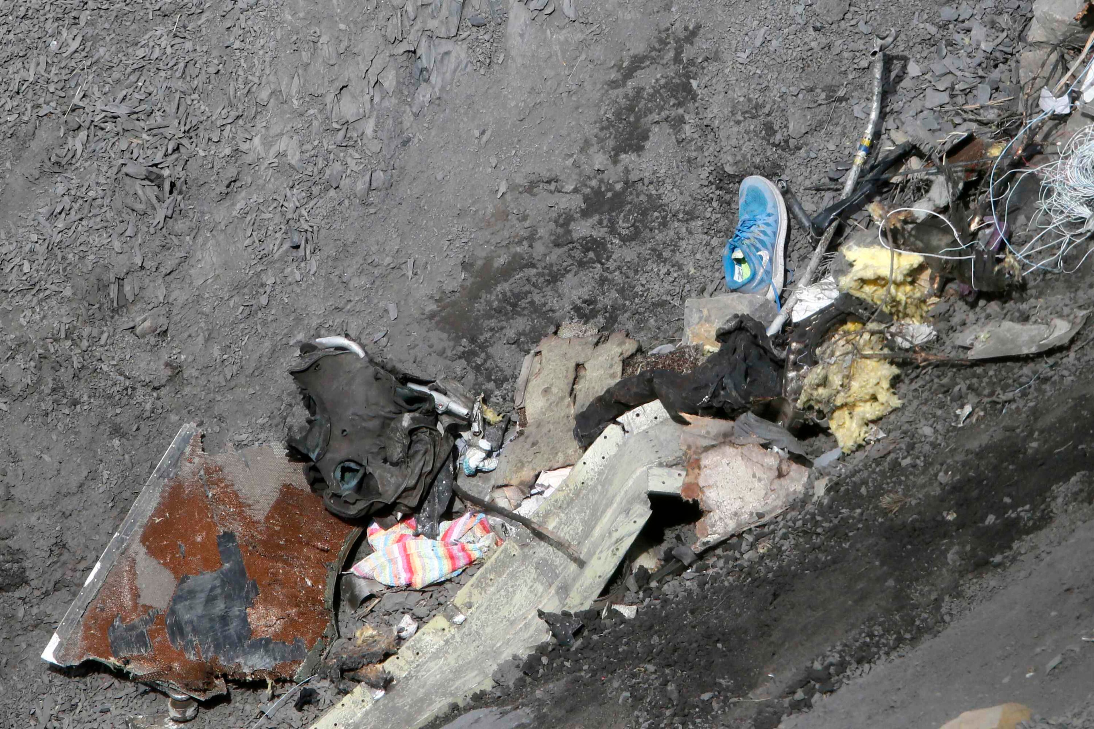 ATTENTION EDITORS - VISUAL COVERAGE OF SCENES OF INJURY OR DEATH Debris from the Germanwings Airbus A320 is seen at the site of the crash, near Seyne-les-Alpes, French Alps March 29, 2015. The young German co-pilot, Andreas Lubitz, suspected of deliberately crashing a passenger plane in the French Alps, killing all 150 people on board including himself, told his girlfriend he was in psychiatric treatment, and that he was planning a spectacular gesture that everyone would remember, the German daily Bild reported on Saturday. Picture taken March 29, 2015. REUTERS/Gonzalo Fuentes