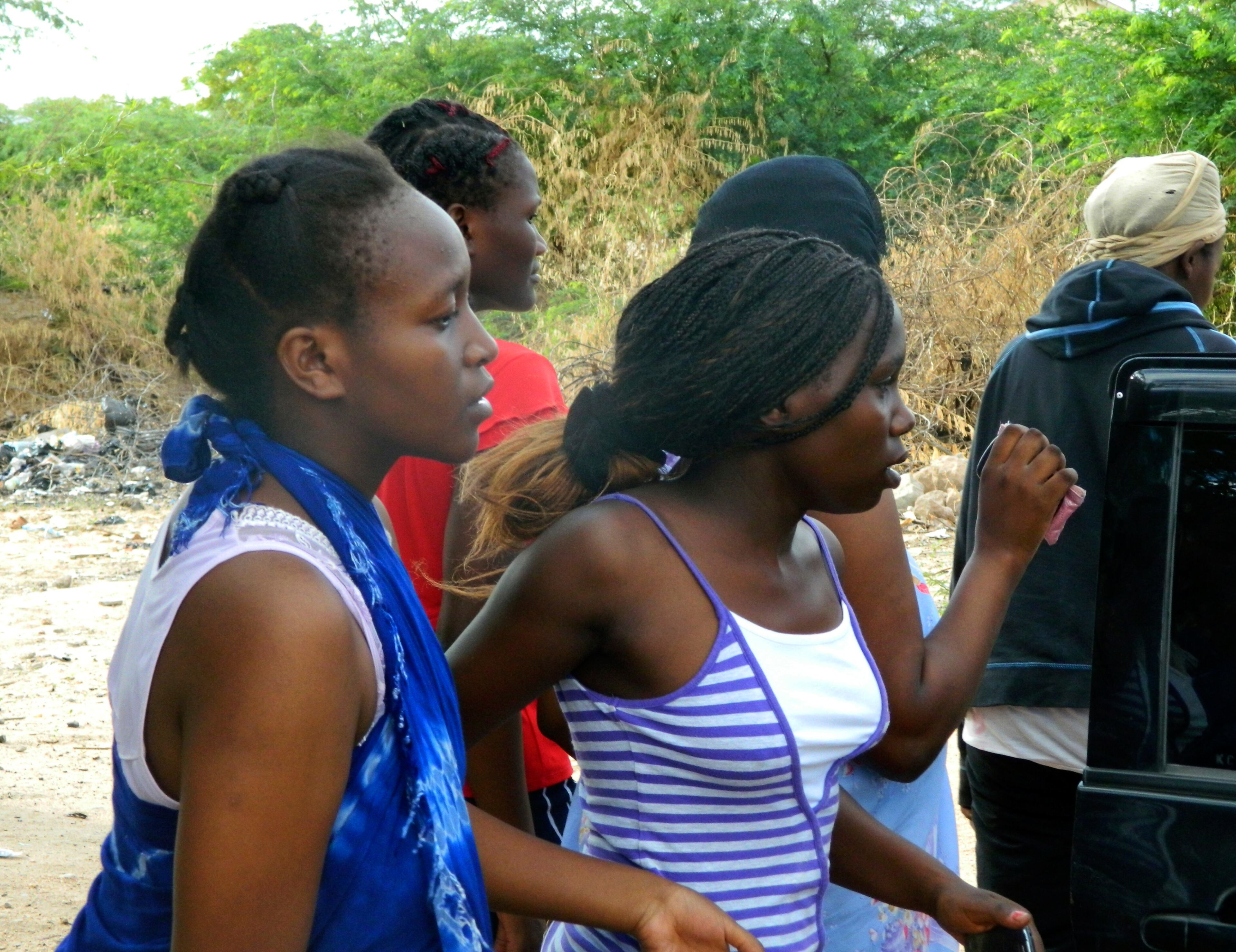 Students of the Garissa University College get out of a house where they seek refuge after fleeing from an attack by gunmen in Garissa, Kenya, Thursday, April 2, 2015. Gunmen attacked the university early Thursday, shooting indiscriminately in campus hostels. Police and military surrounded the buildings and were trying to secure the area in eastern Kenya, police officer Musa Yego said. (AP Photo)