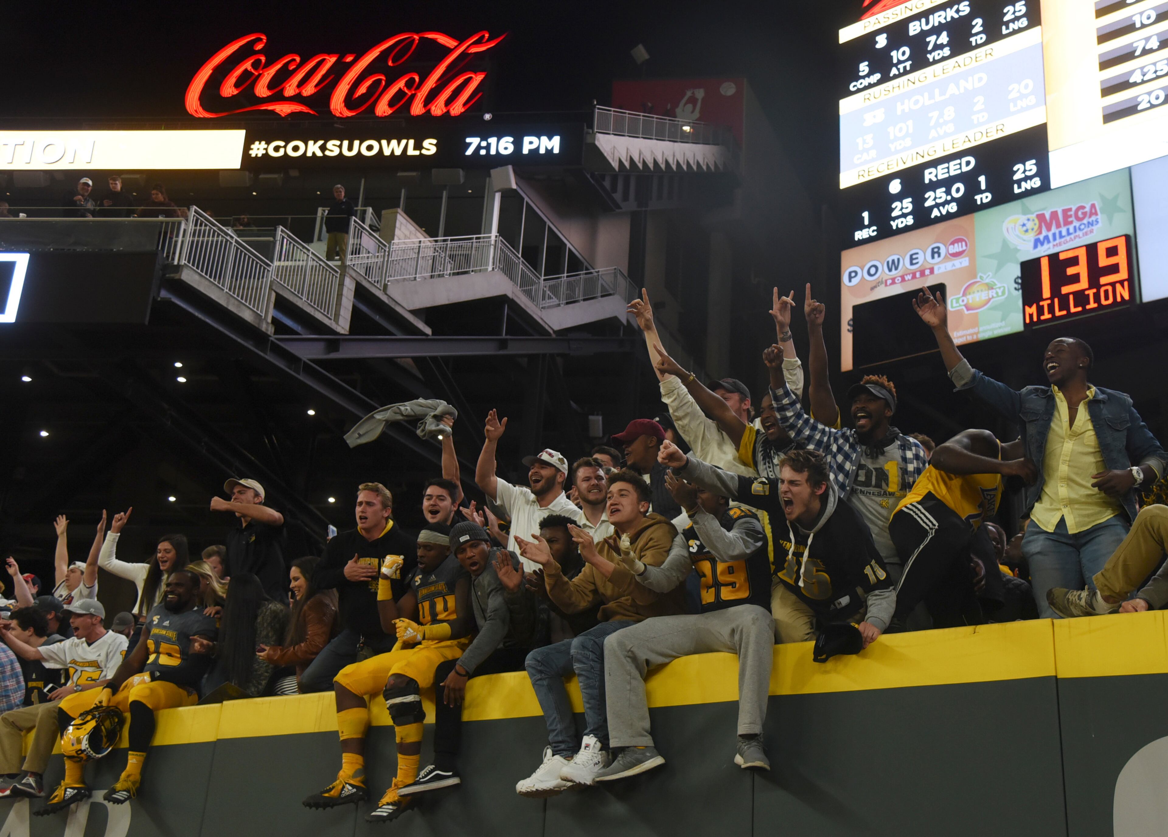 Kennesaw State University football players and students celebrate their win over Jacksonville State University at SunTrust Park, Saturday, Nov. 17, 2018, in Atlanta. Kennesaw won in overtime, 60-52. (Annie Rice/AJC)