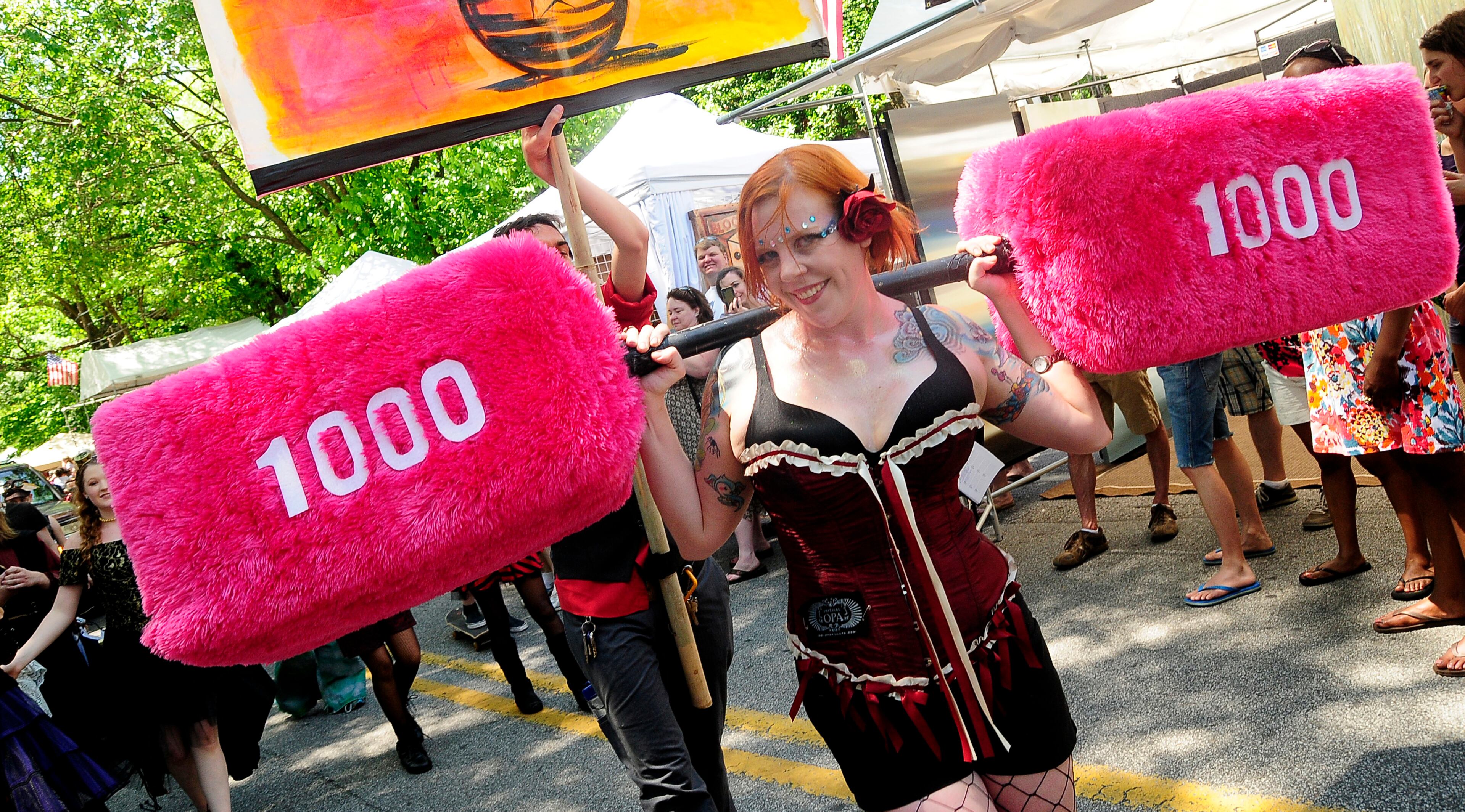 Imperial OPA Circus strong lady who lifts anything in pink velvet took part in the Inman Park festival parade.