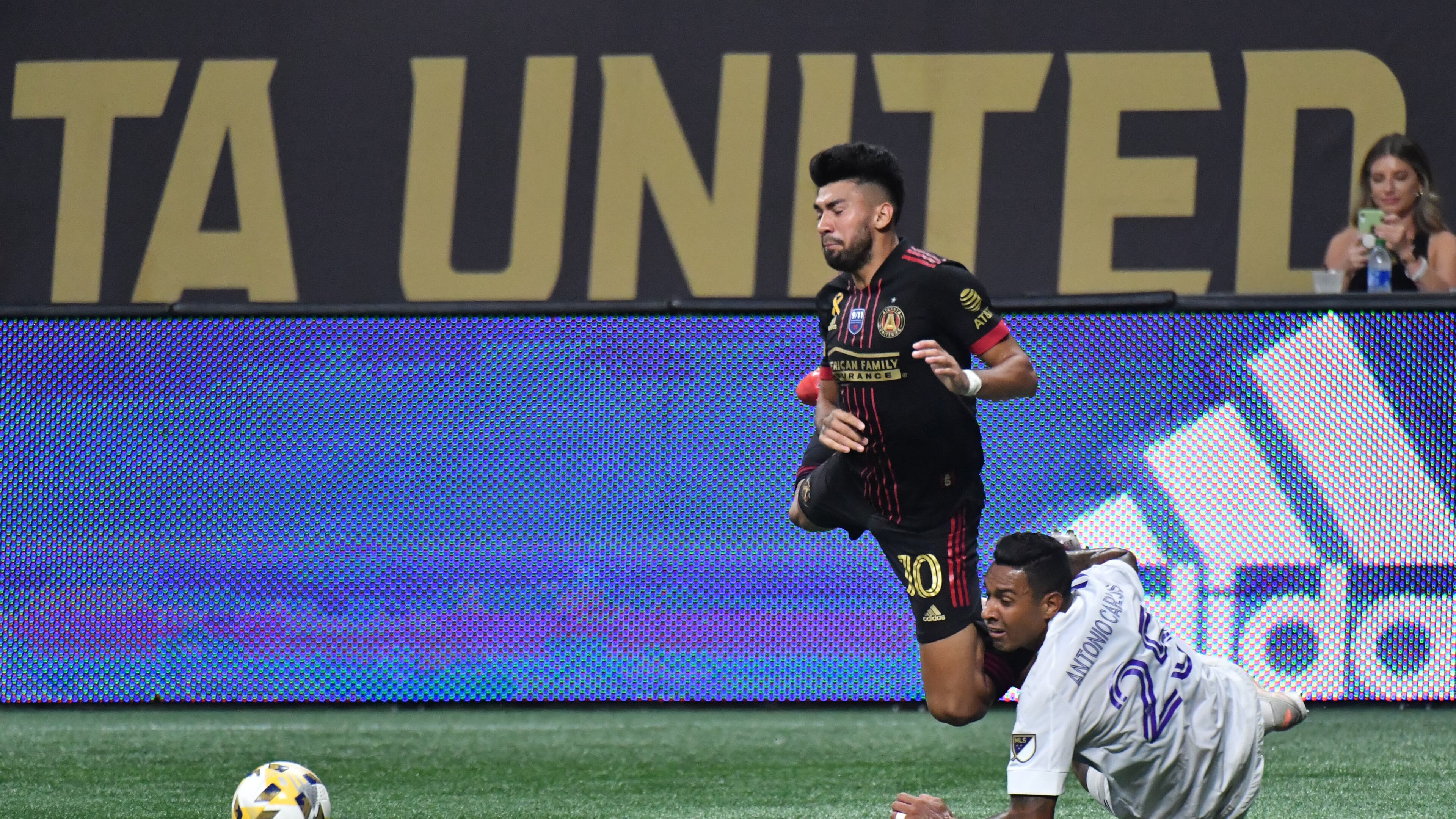 September 10, 2021 Atlanta - Atlanta United's midfielder Marcelino Moreno (10) is fouled by Orlando City's defender Antonio Carlos (25) during the first half in a MLS soccer match at Mercedes-Benz Stadium in Atlanta on Friday, September 10, 2021. (Hyosub Shin / Hyosub.Shin@ajc.com)