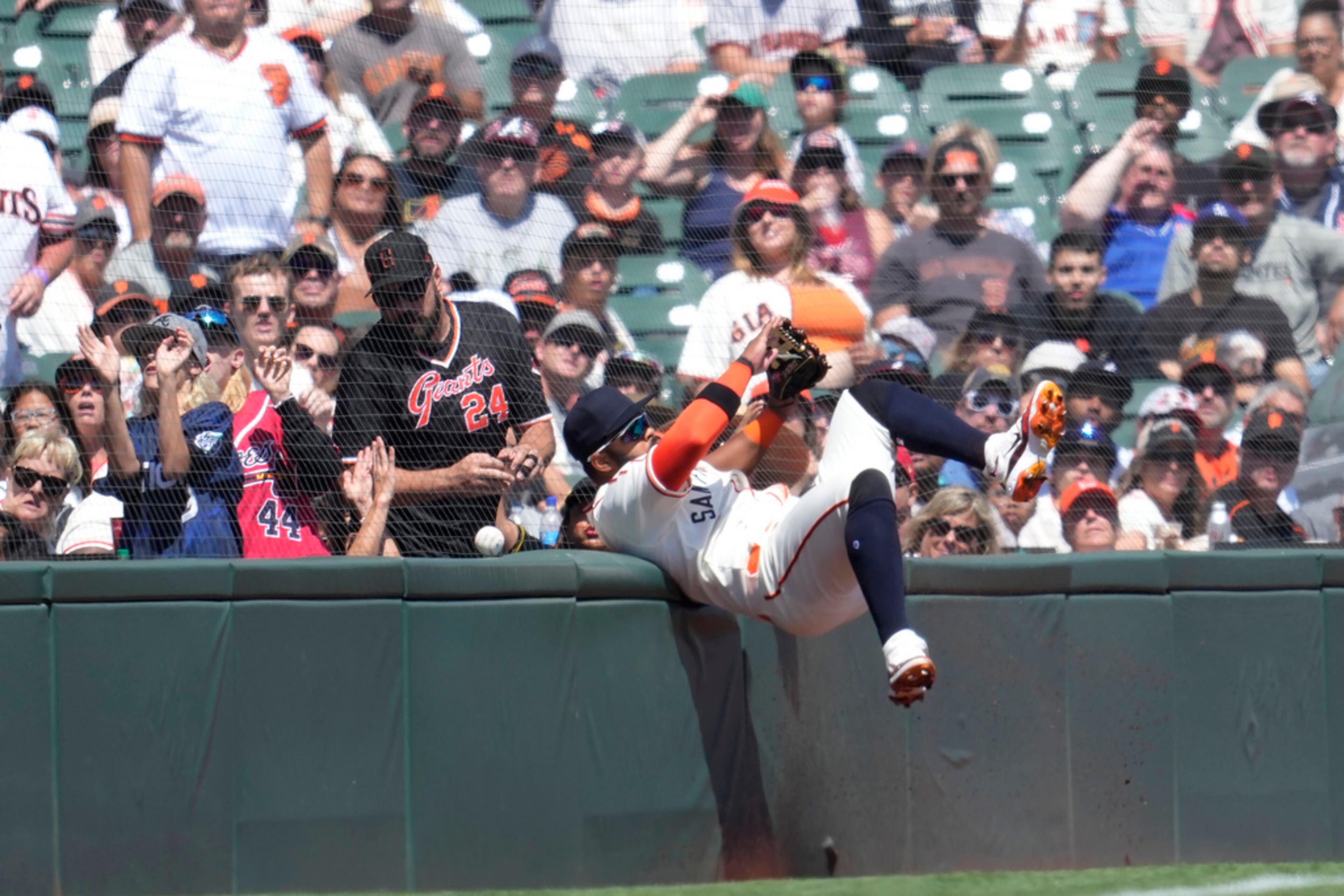 San Francisco Giants left fielder Heliot Ramos cannot catch a ball in foul territory hit by Atlanta Braves' Eddie Rosario during the third inning of a baseball game in San Francisco, Saturday, Aug. 26, 2023. (AP Photo/Jeff Chiu)
