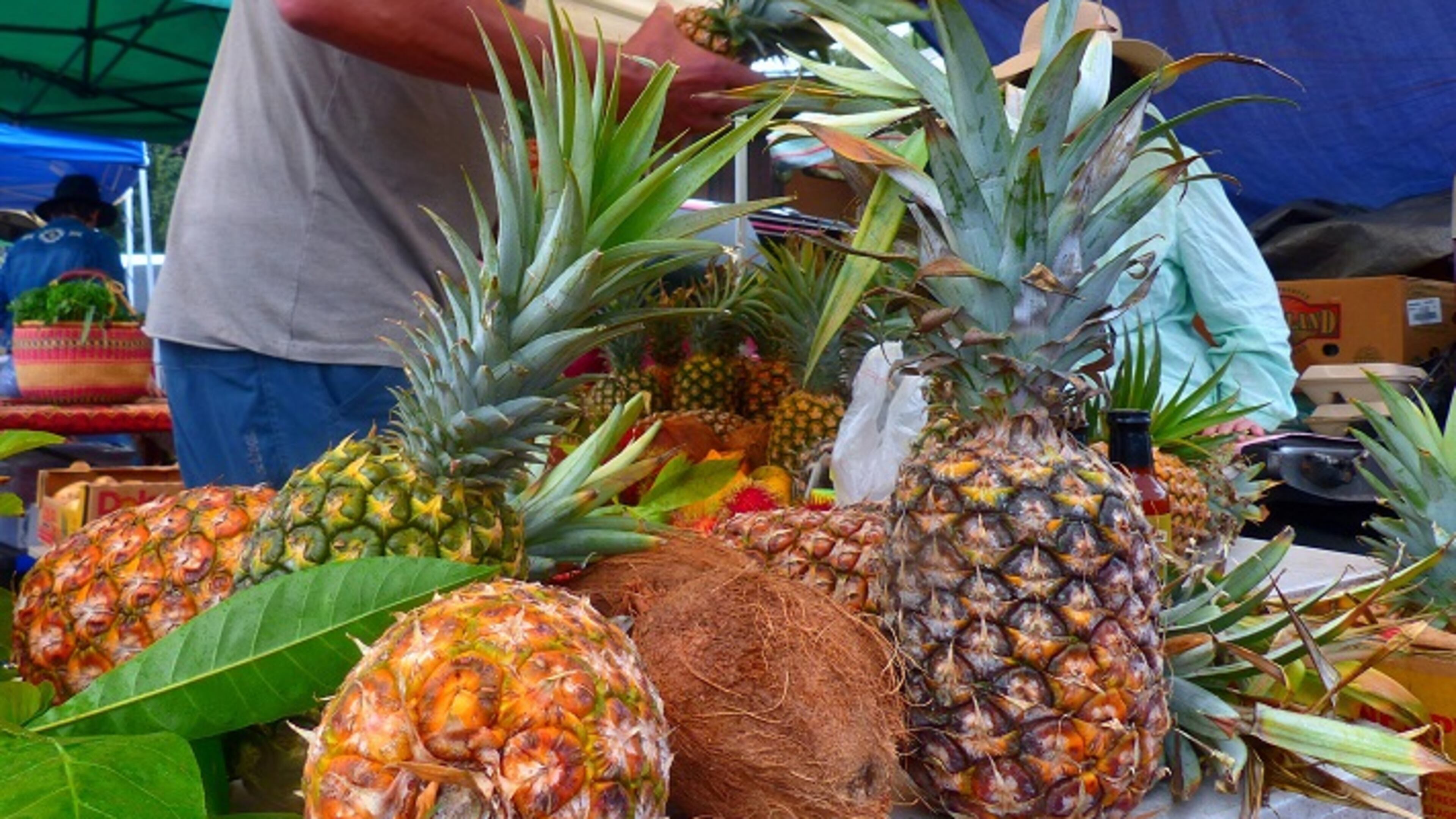 Fresh fruit makes Hanalei's Saturday Farmers Market a visit worth savoring. Besides pineapples and coconuts, a local specialty is longan, a cousin of lychee fruit. (Daniel Beekman/The Seattle Times/TNS)
