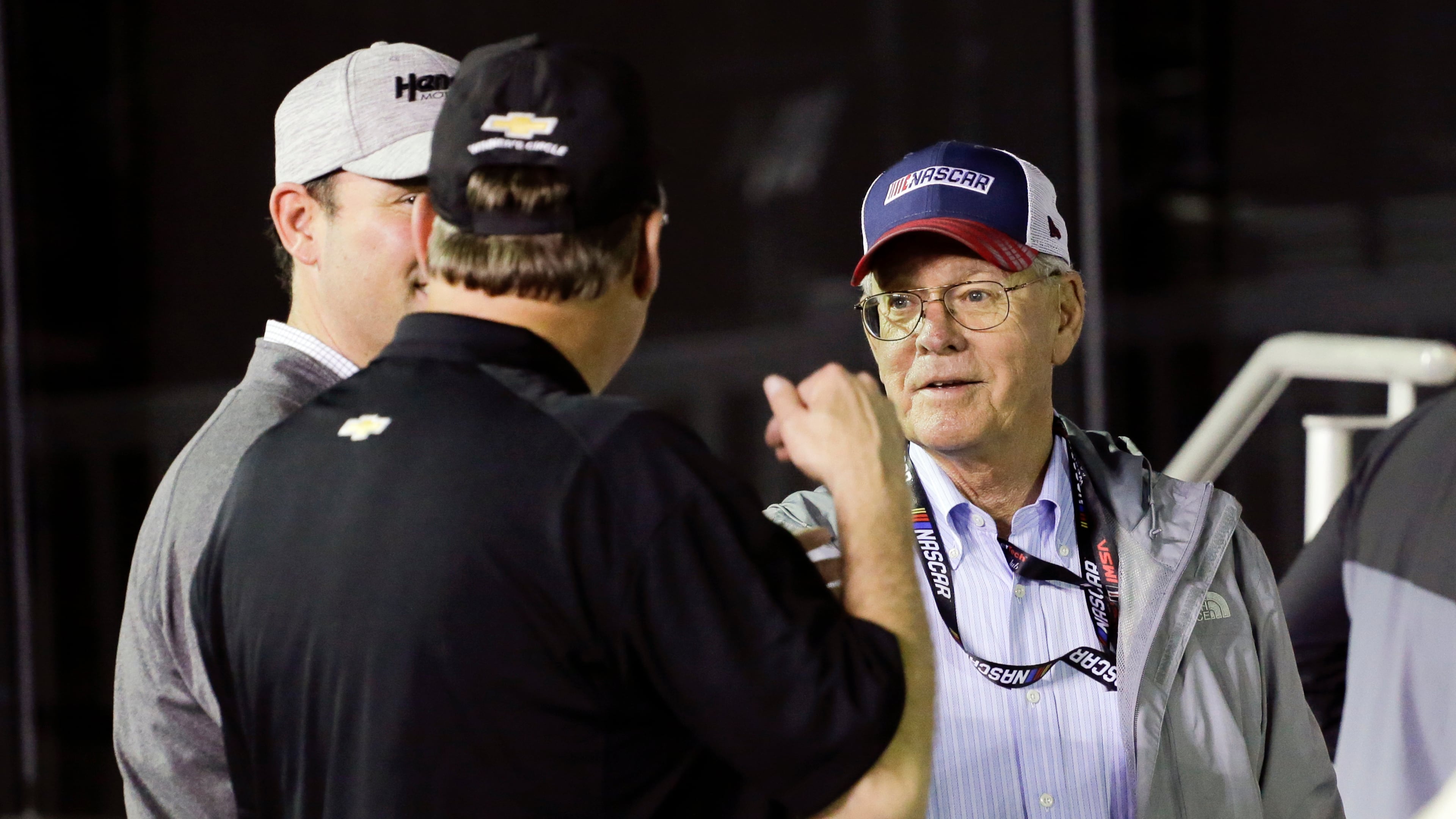 FILE - Jim France, right, chairman and executive vice president of NASCAR, talks with sponsors in Victory Lance after the second of two NASCAR Daytona 500 qualifying auto races at Daytona International Speedway, Thursday, Feb. 13, 2020, in Daytona Beach, Fla. (AP Photo/Terry Renna, File_