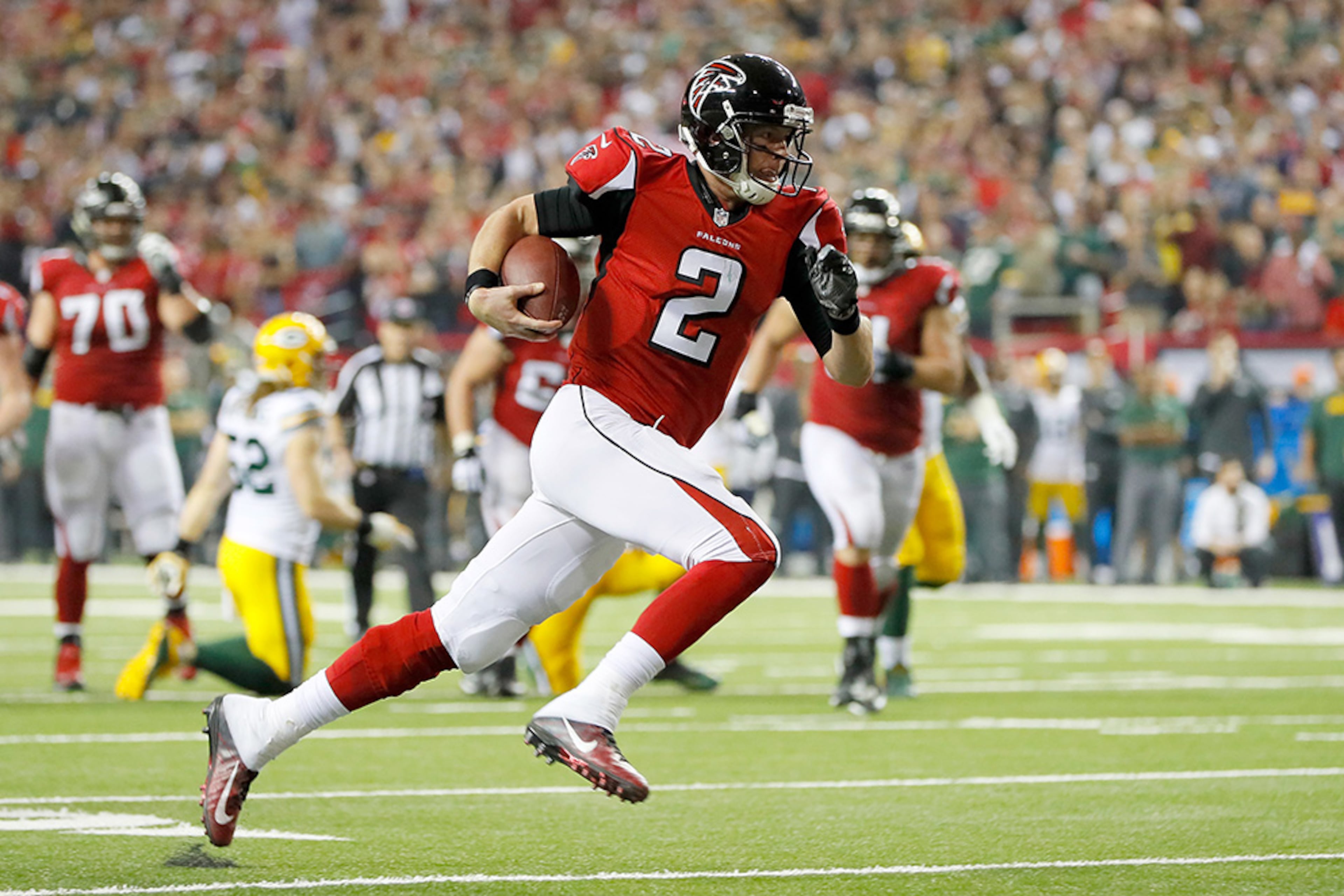 Falcons quarterback Matt Ryan runs for a 14-yard touchdown to give Atlanta a 17-0 lead over the Green Bay Packers in the NFC Championship Game at the Georgia Dome Jan. 22, 2017 in Atlanta.