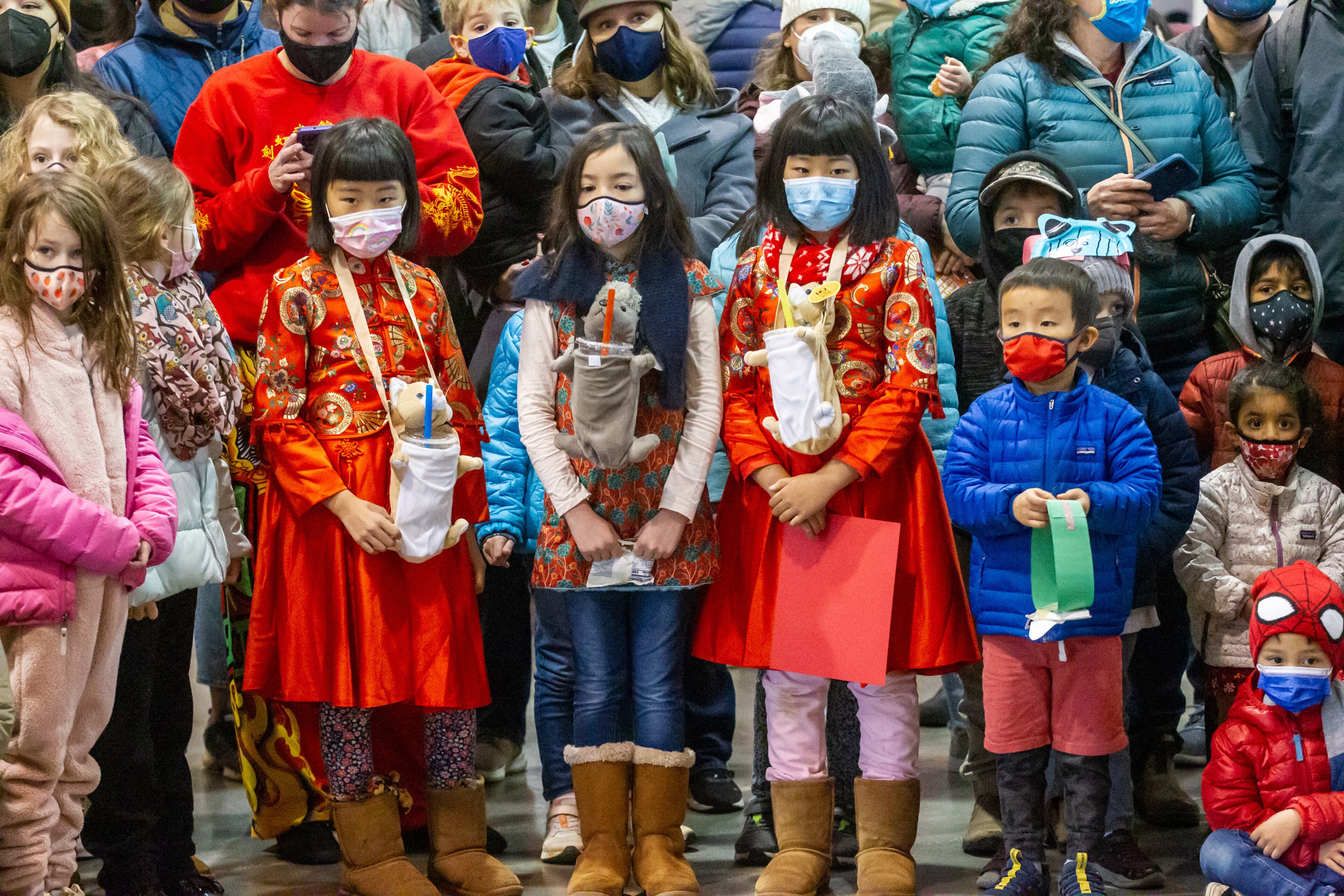 Children watch the Lion Dance during Decatur's first Lunar New Year celebration at Legacy Park on Saturday, January 29, 2022. STEVE SCHAEFER FOR THE ATLANTA JOURNAL-CONSTITUTION