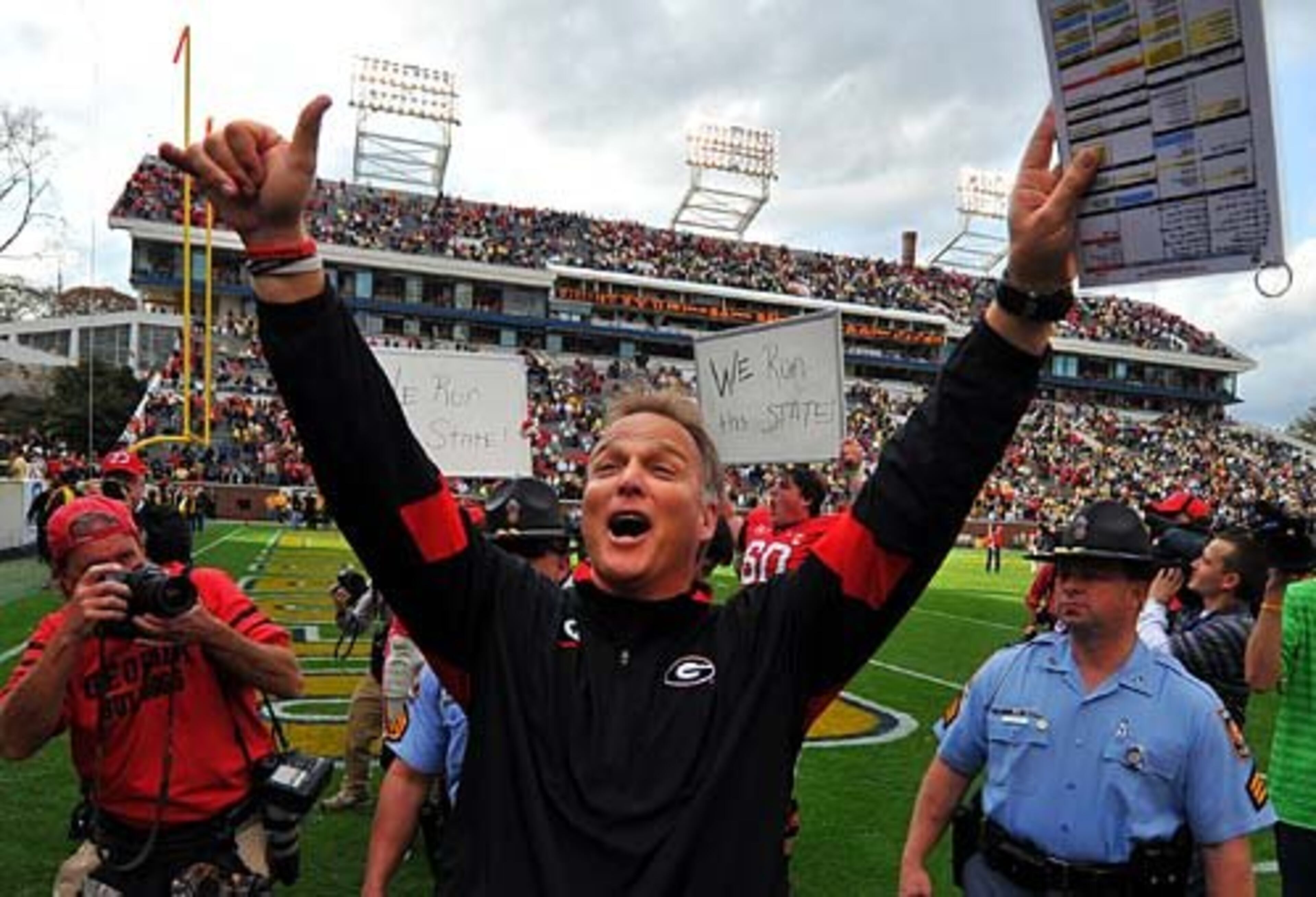 Georgia head coach Mark Richt celebrates the Bulldogs win over Georgia Tech. Richt is now 10-1 against Tech as UGA head coach.