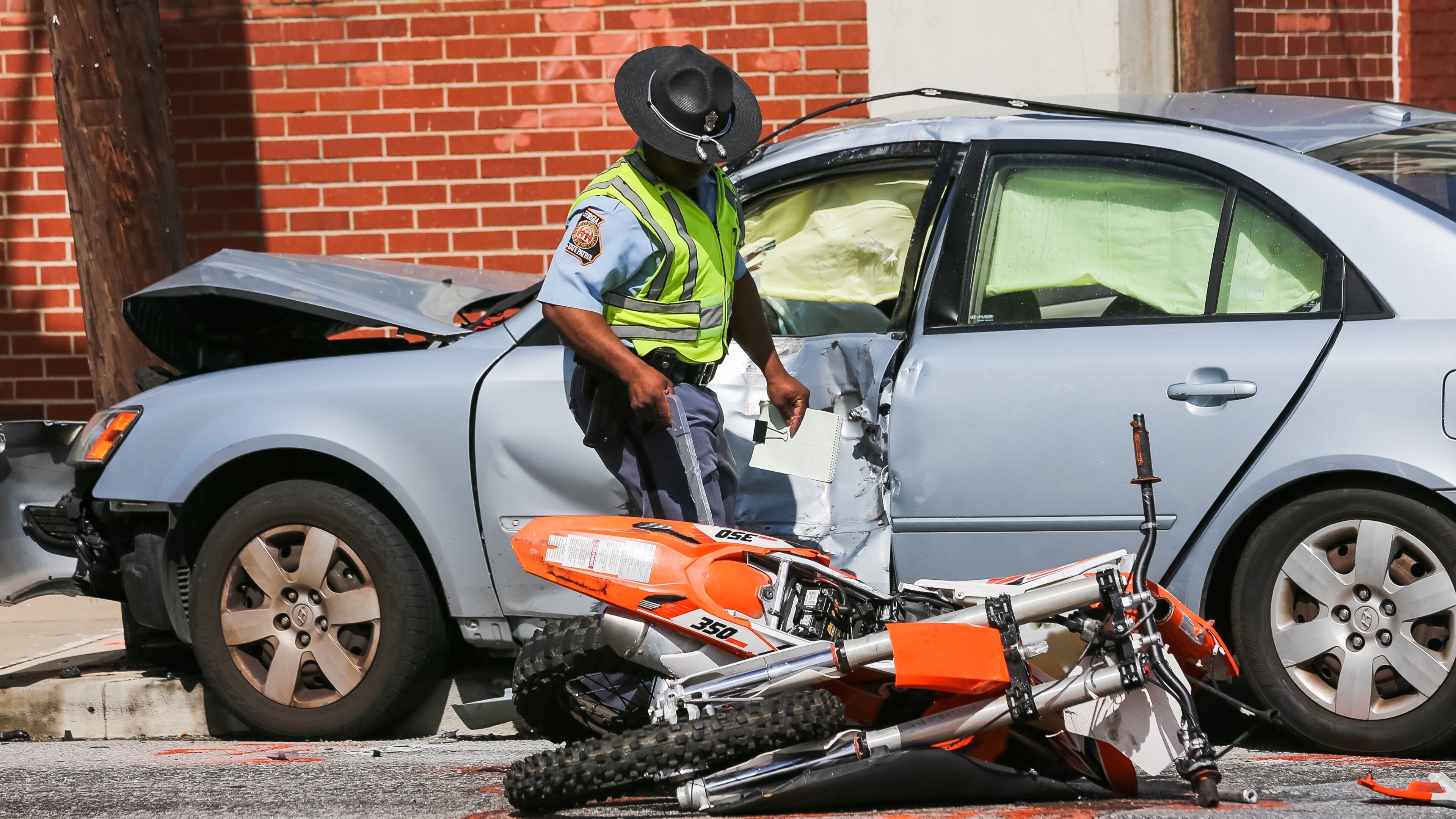 Law enforcement officials were investigating a fatal accident Fri., March 18, 2016, in Atlanta. JOHN SPINK / JSPINK@AJC.COM