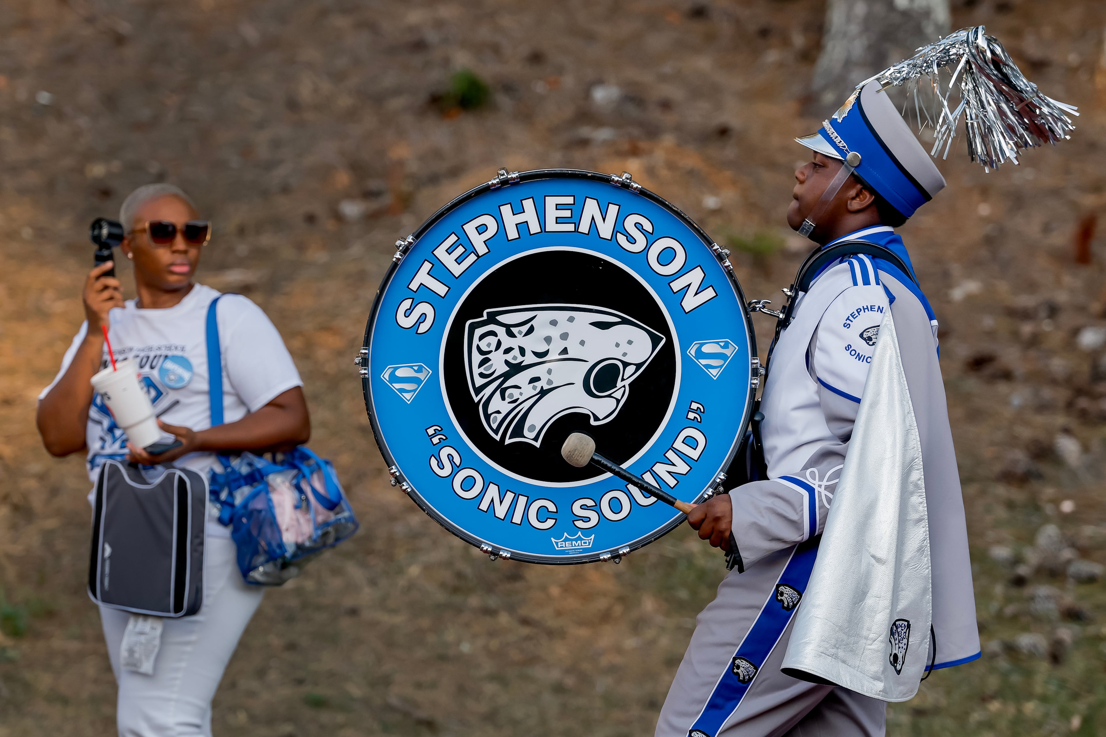 A drummer with the Stephenson High School Marching Band arrives for a game between Tucker and Stephenson at Hallford Stadium on Friday, Sept. 4, 2026, in Clarkston. (Erik S. Lesser for the AJC)