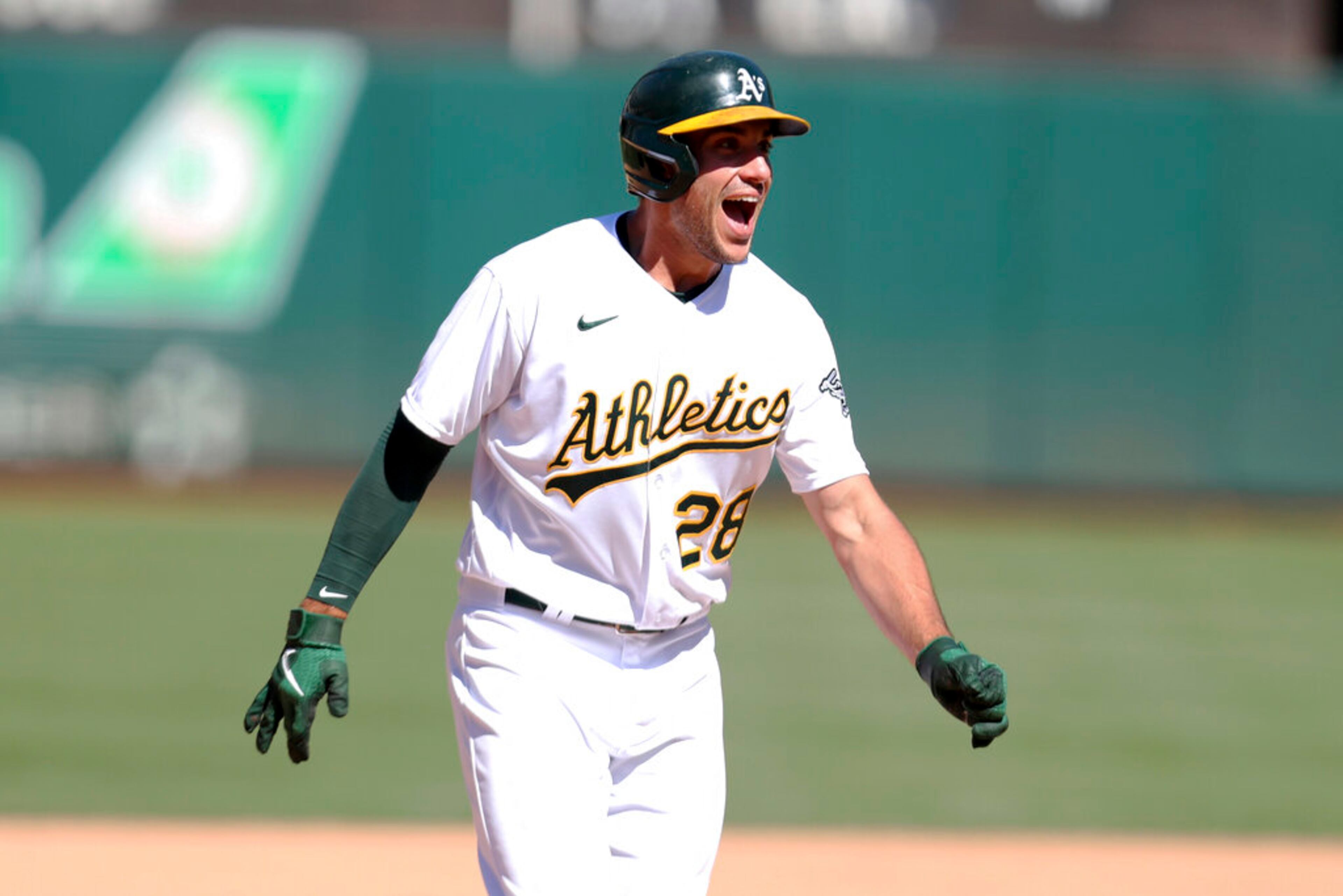 Oakland Athletics' Matt Olson celebrates after hitting a game winning double against the San Diego Padres during the tenth inning of a baseball game in Oakland, Calif., Wednesday, Aug. 4, 2021. (AP Photo/Jed Jacobsohn)