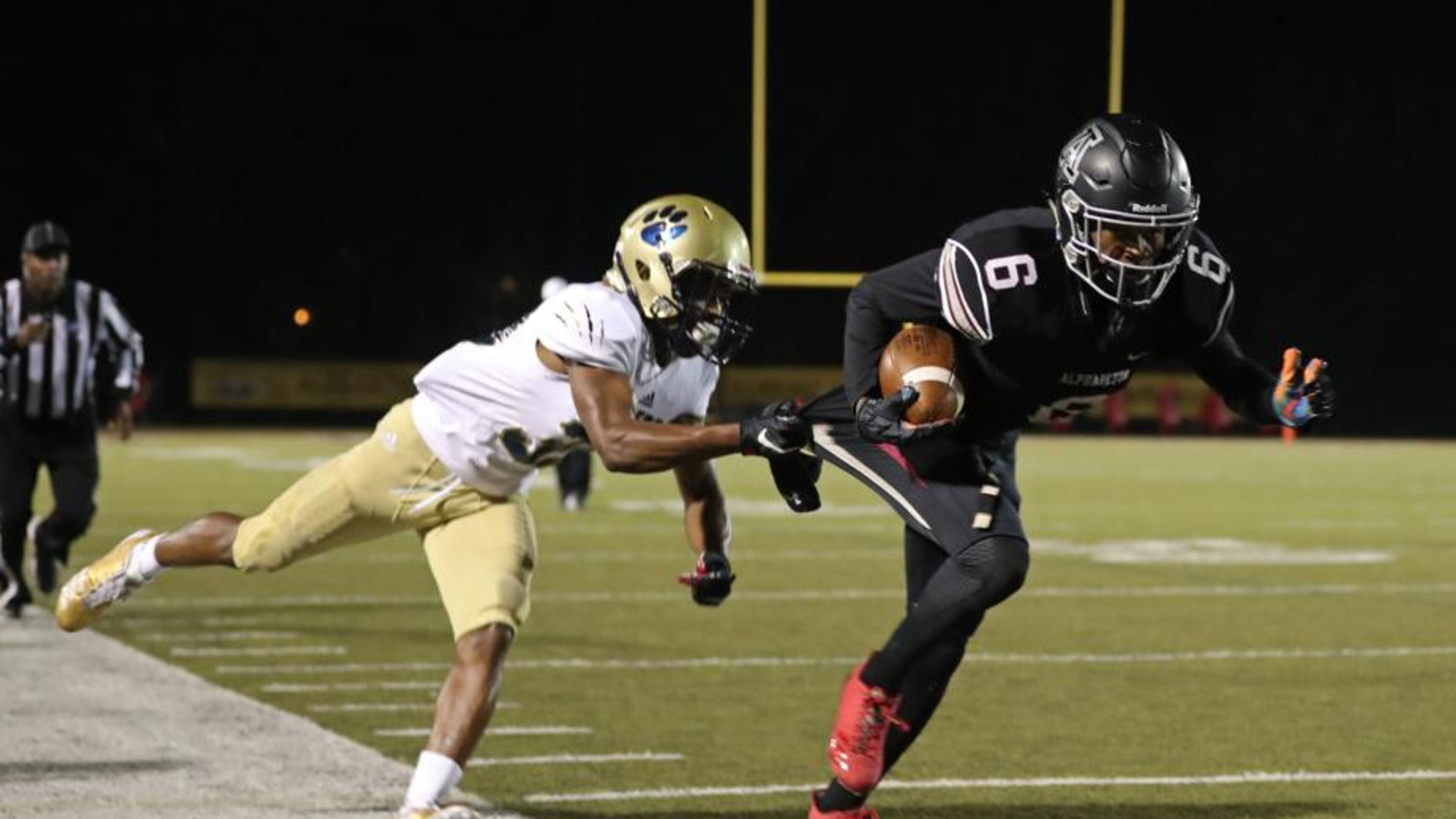 Alpharetta wide receiver Spencer Gaddis (6) gets by a Douglas County defender after a catch in the second round of the Class AAAAAA playoffs at Alpharetta High School Friday, November 17, 2017, in Alpharetta. PHOTO / JASON GETZ