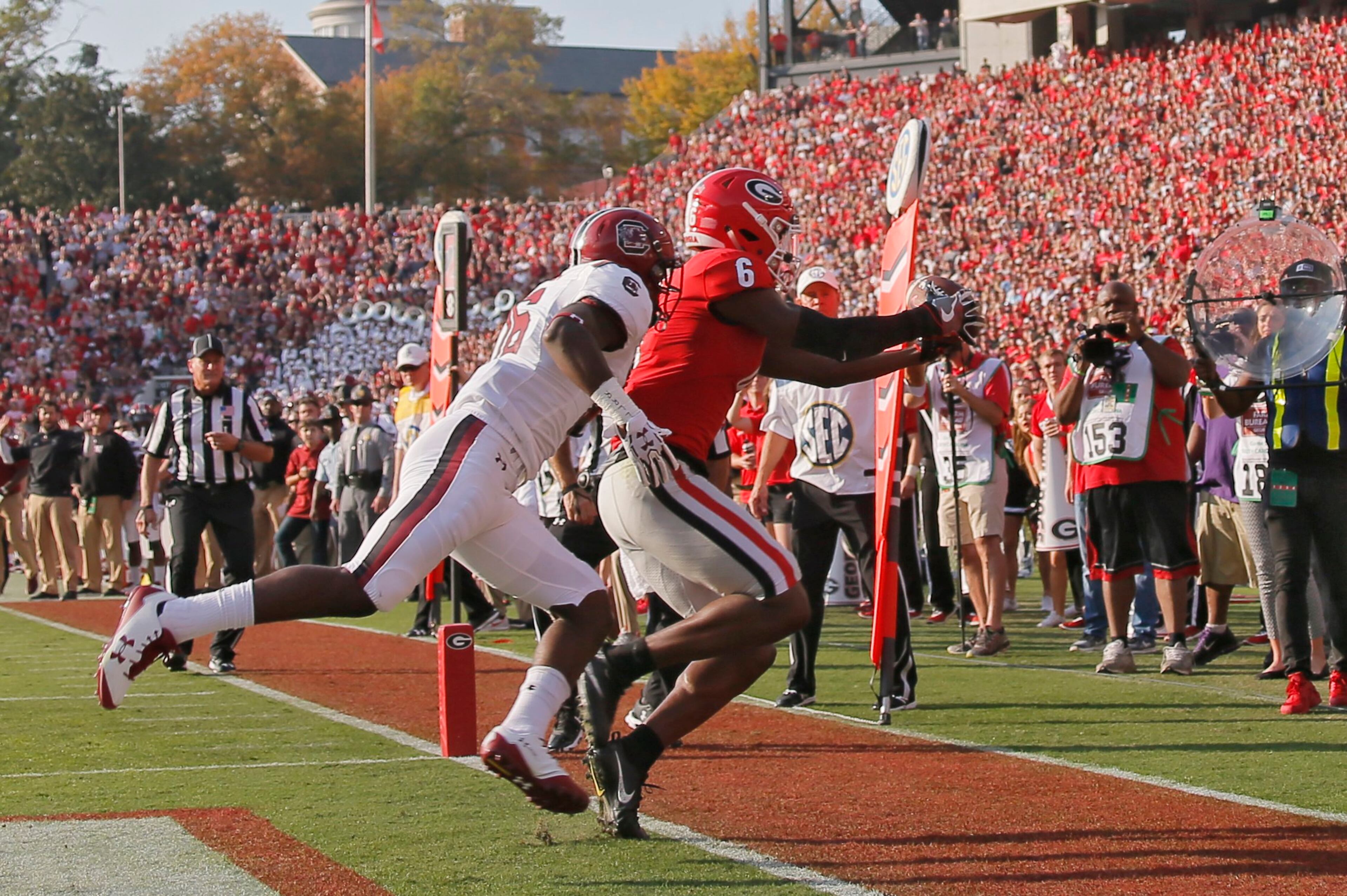 11/4/17 - Athens - Georgia Bulldogs wide receiver Javon Wims (6) scores UGA's 2nd TD on this pass that was first ruled incomplete. Defender is South Carolina Gamecocks defensive back Rashad Fenton (16). NCAA football game between the University of Georgia Bulldogs and the University of South Carolina Gamecocks BOB ANDRES /BANDRES@AJC.COM
