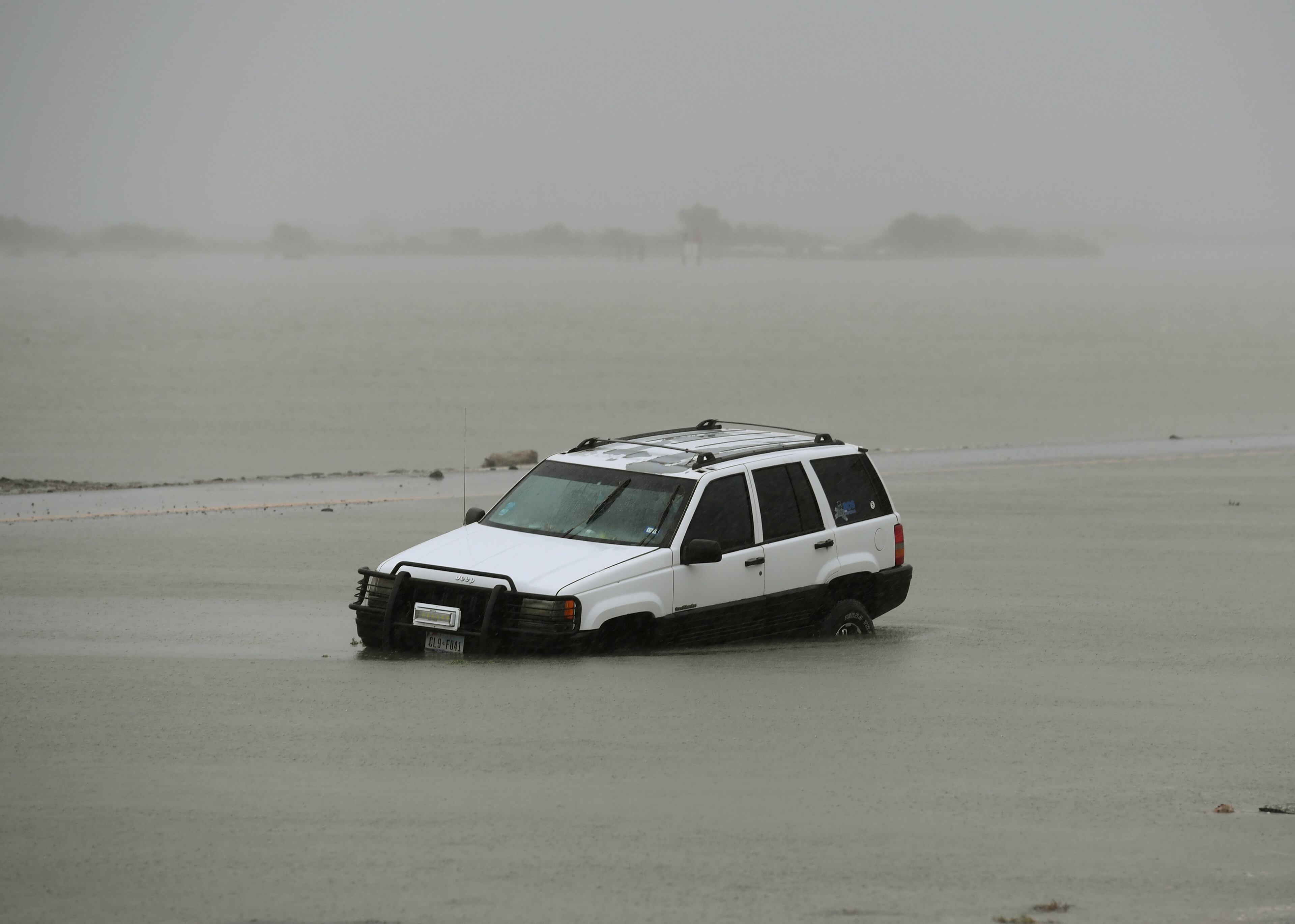 A car lies submerged after Hurricane Harvey hit Corpus Christi, Texas on August 26, 2017. Hurricane Harvey hit the Texas coast with forecasters saying its possible for up to 3 feet of rain and 125 mph winds.
Hurricane Harvey slammed into the Texas coast late Friday, unleashing torrents of rain and packing powerful winds, the first major storm to hit the US mainland in 12 years. / AFP PHOTO / MARK RALSTON (Photo credit should read MARK RALSTON/AFP/Getty Images)