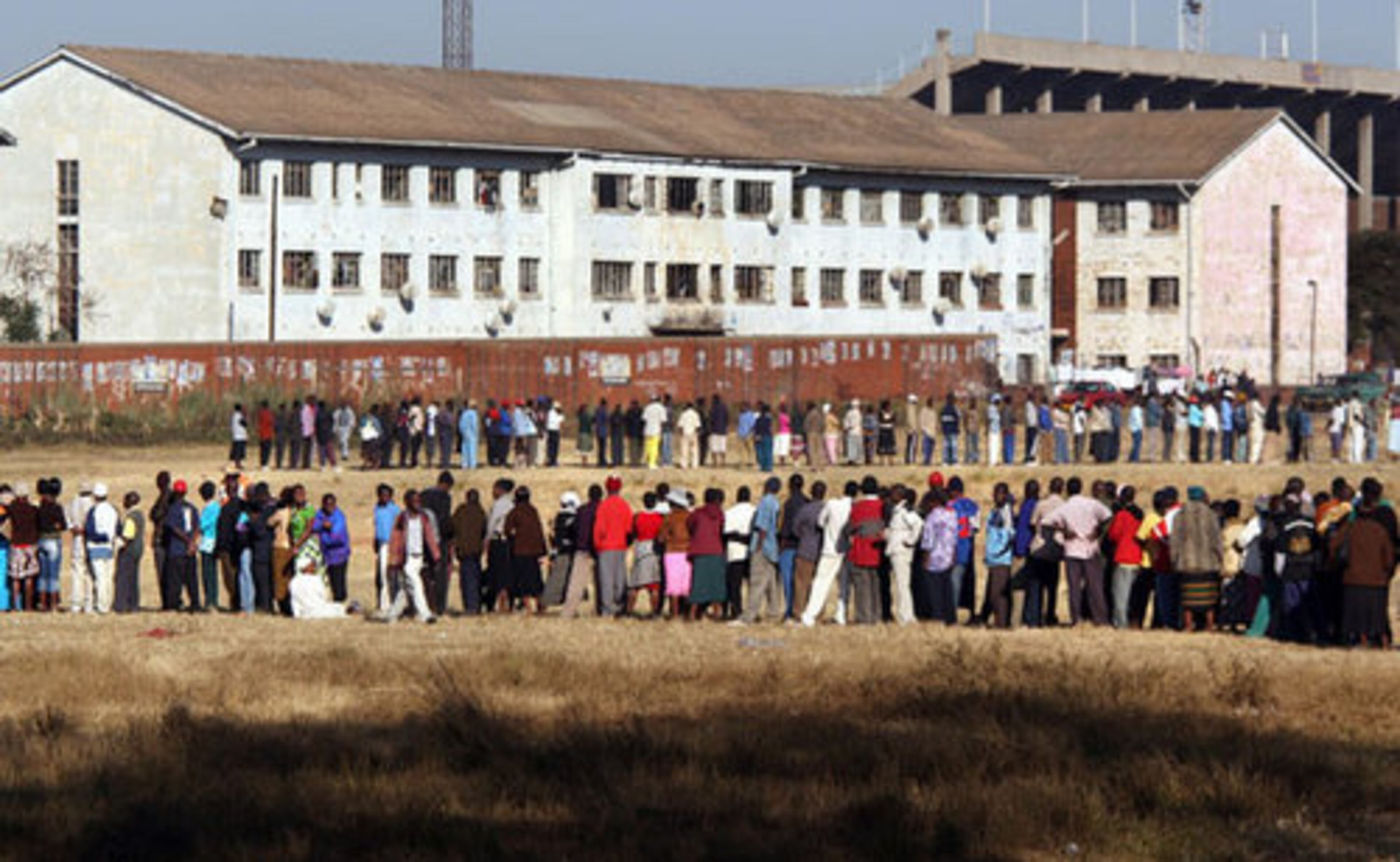Voters line up to cast their ballots on Friday in Harare, Zimbabwe. The runoff presidential election, which is being boycotted by oppostion leader Morgan Tsvangirai, only has one candidate -- President Robert Mugabe.