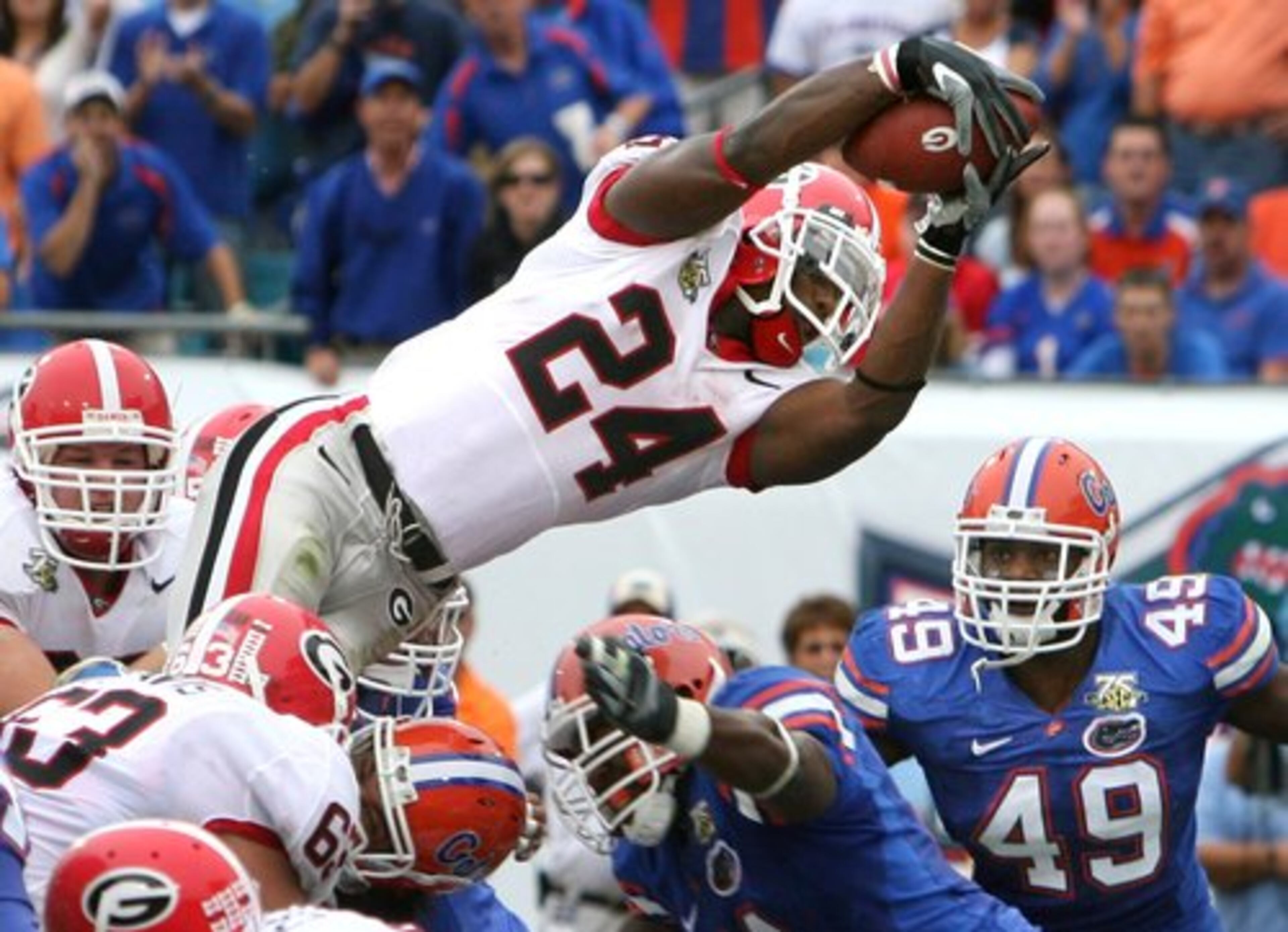 Knowshon Moreno led the Dogs with 1,334 yards rushing and 14 touchdowns, including this leap against Florida ...
