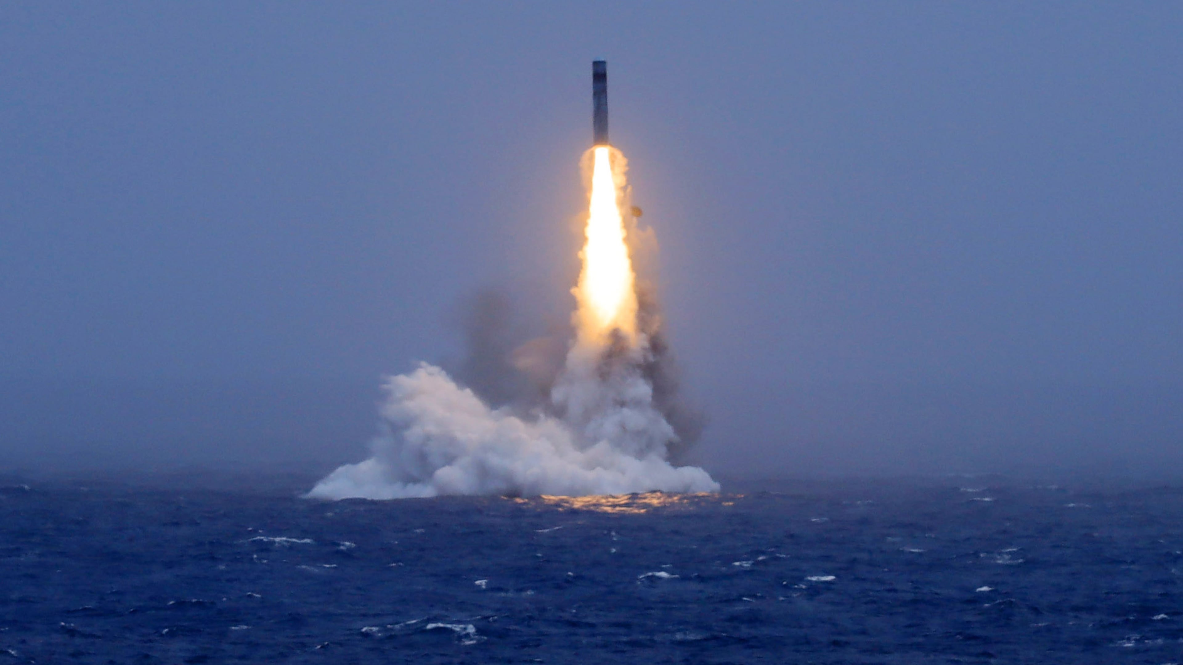 In this photo released by Xinhua News Agency, a long-range ballistic missile bursts out of the sea during a test launched from a Chinese nuclear-powered submarines in the South Pacific on Monday, July 6, 2026. (Li Xiangchao/Xinhua via AP)