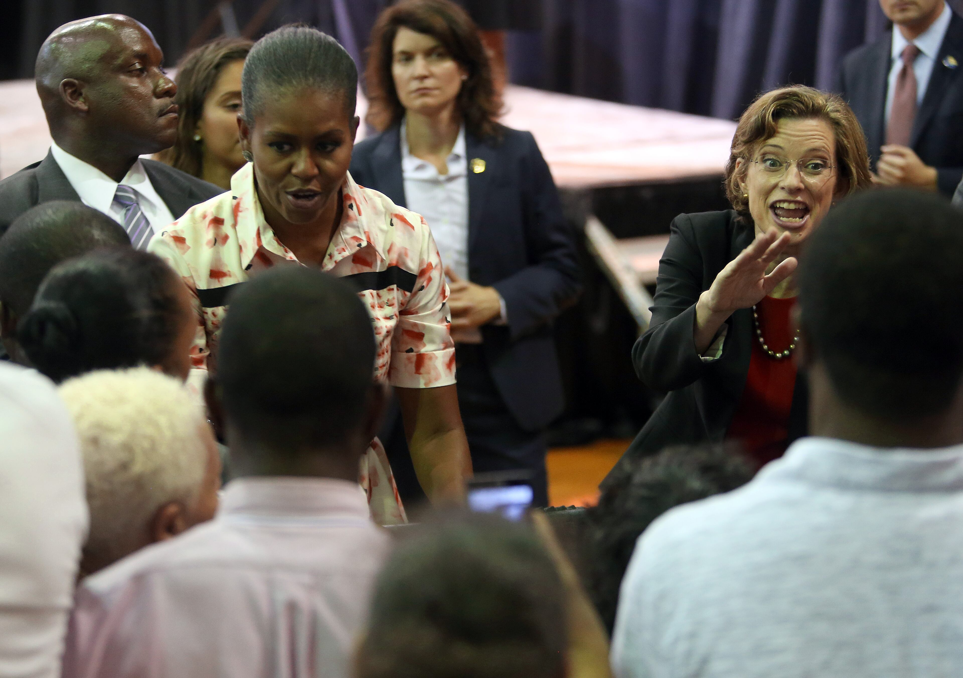 First Lady Michelle Obama and Senate candidate Michelle Nunn greet supporters following a voter registration rally Monday evening Sept. 8, 2014, at the Martin Luther King Jr. Recreation Center in Atlanta. BEN GRAY / BGRAY@AJC.COM