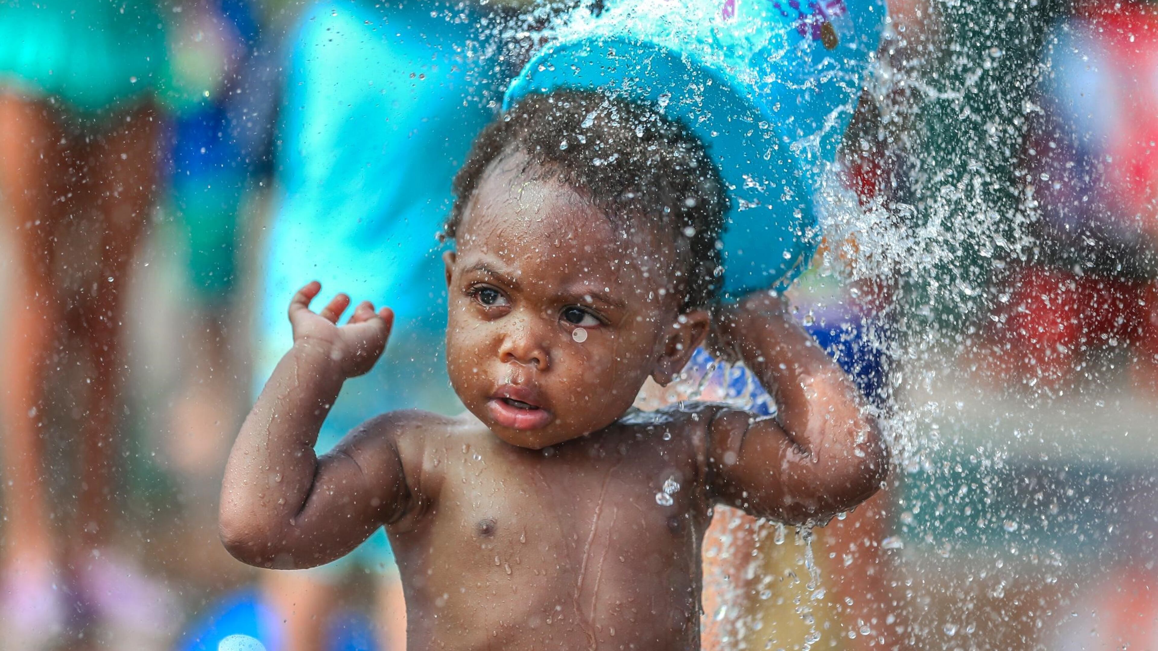 Michael Watts, 16 months, enjoyed a field trip with mother Kayla Watts (not pictured), who brought her East Lake Early Learning Academy Pre-K class on their year-end field trip to the Splashpad at Atlanta’s Historic Fourth Ward Park on Fri., June 24, 2016. JOHN SPINK / JSPINK@AJC.COM