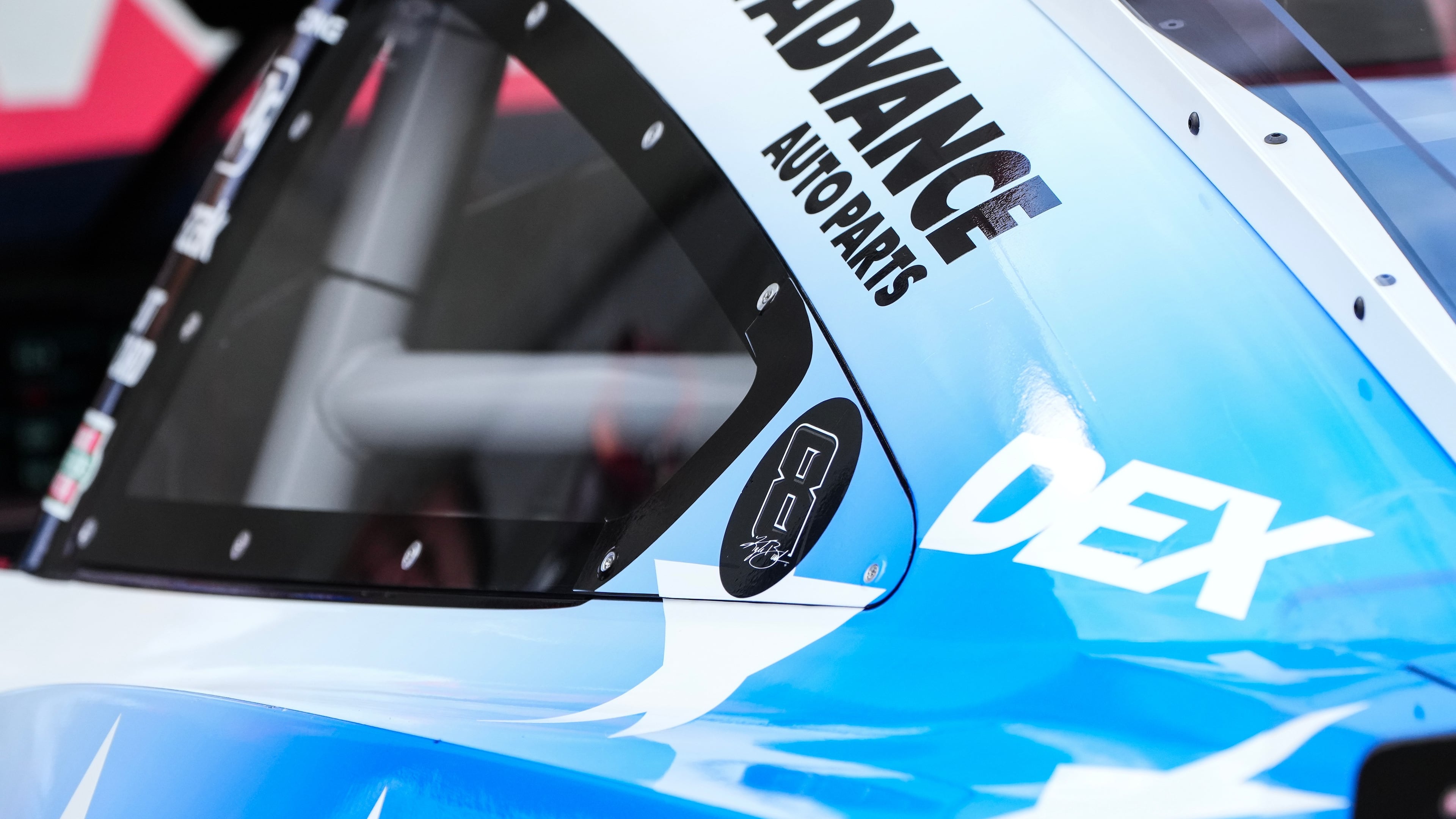 A decal is displayed on Denny Hamlin's car in honor of late driver Kyle Busch prior to a NASCAR Cup Series auto race, Sunday, May 24, 2026, in Charlotte, N.C. (AP Photo/Matt Kelley)