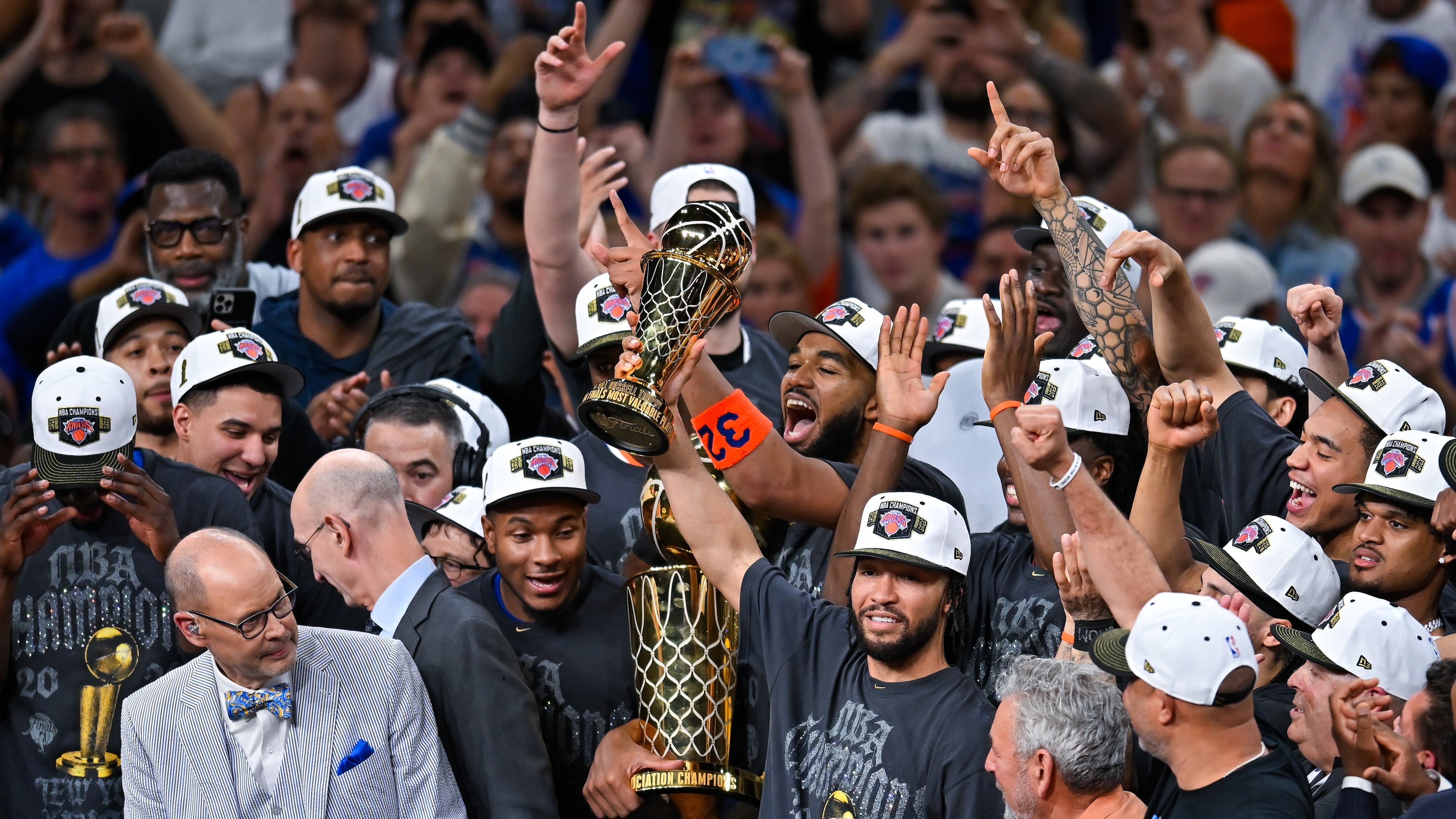New York Knicks guard Jalen Brunson holds the MVP trophy after the Knicks defeated the San Antonio Spurs in Game 5 of the NBA Finals basketball series, Saturday, June 13, 2026, in San Antonio. (AP Photo/Darren Abate)