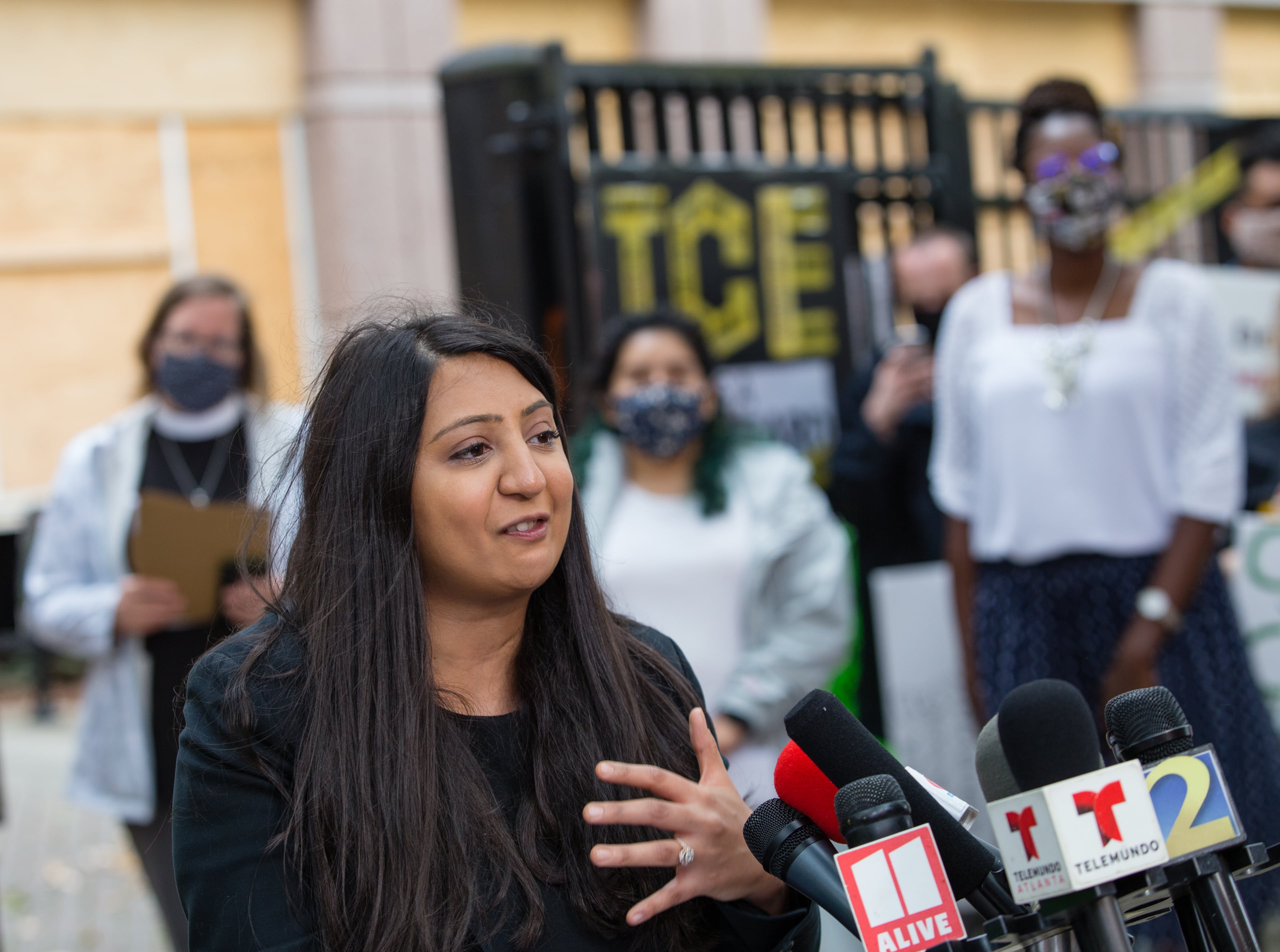 Project South attorney Priyanka Bhatt speaks during a press conference in front of the Atlanta ICE field office in 2020. (Jenni Girtman for the AJC 2020)