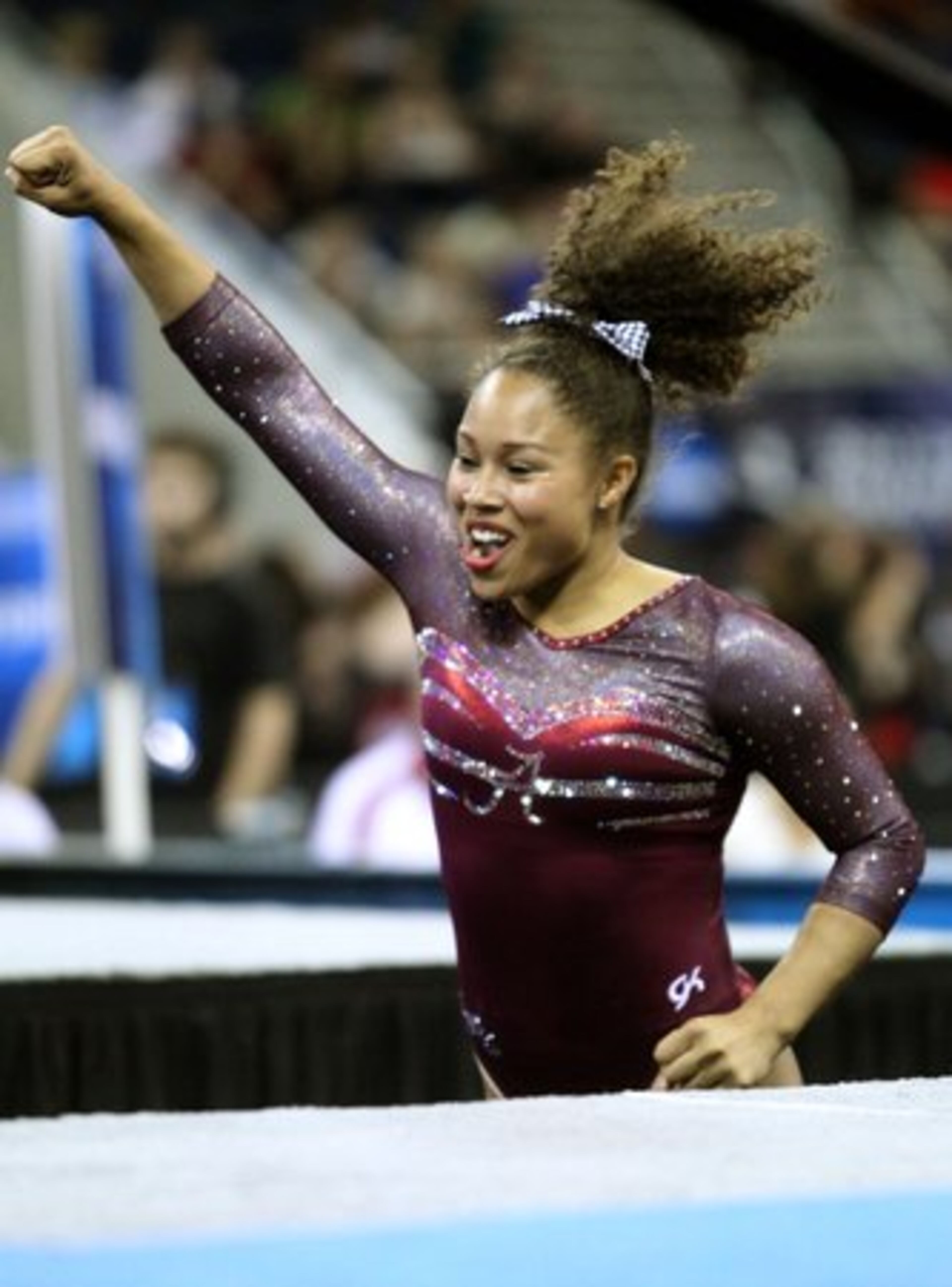 Alabama's Diandra Milliner reacts after competing in the vault exercise.