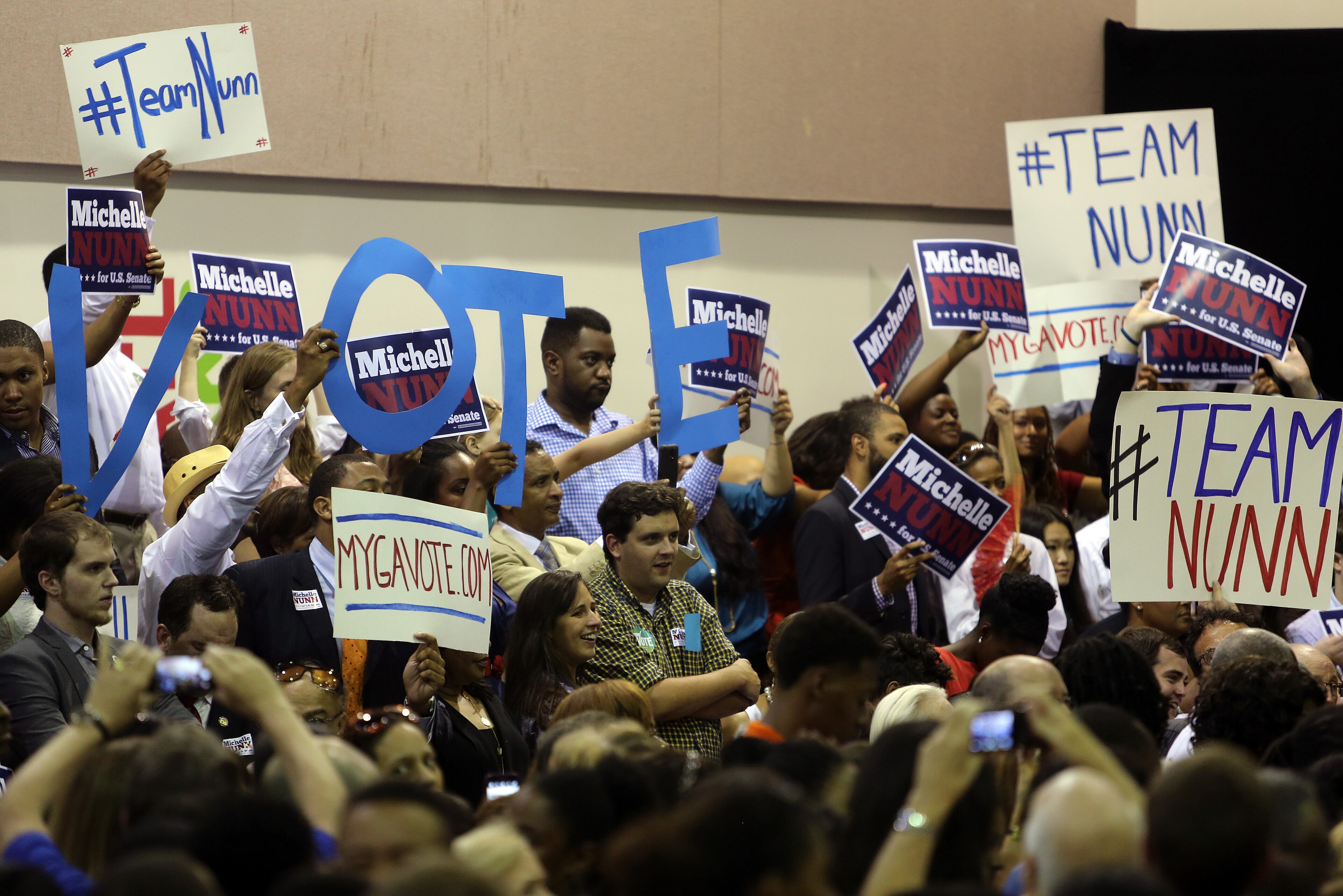 A crowd of supporters waits for the beginning of a voter registration rally featuring Michelle Nunn and First Lady Michelle Obama on Monday evening Sept. 8, 2014, at the Martin Luther King Jr. Recreation Center in Atlanta. BEN GRAY / BGRAY@AJC.COM