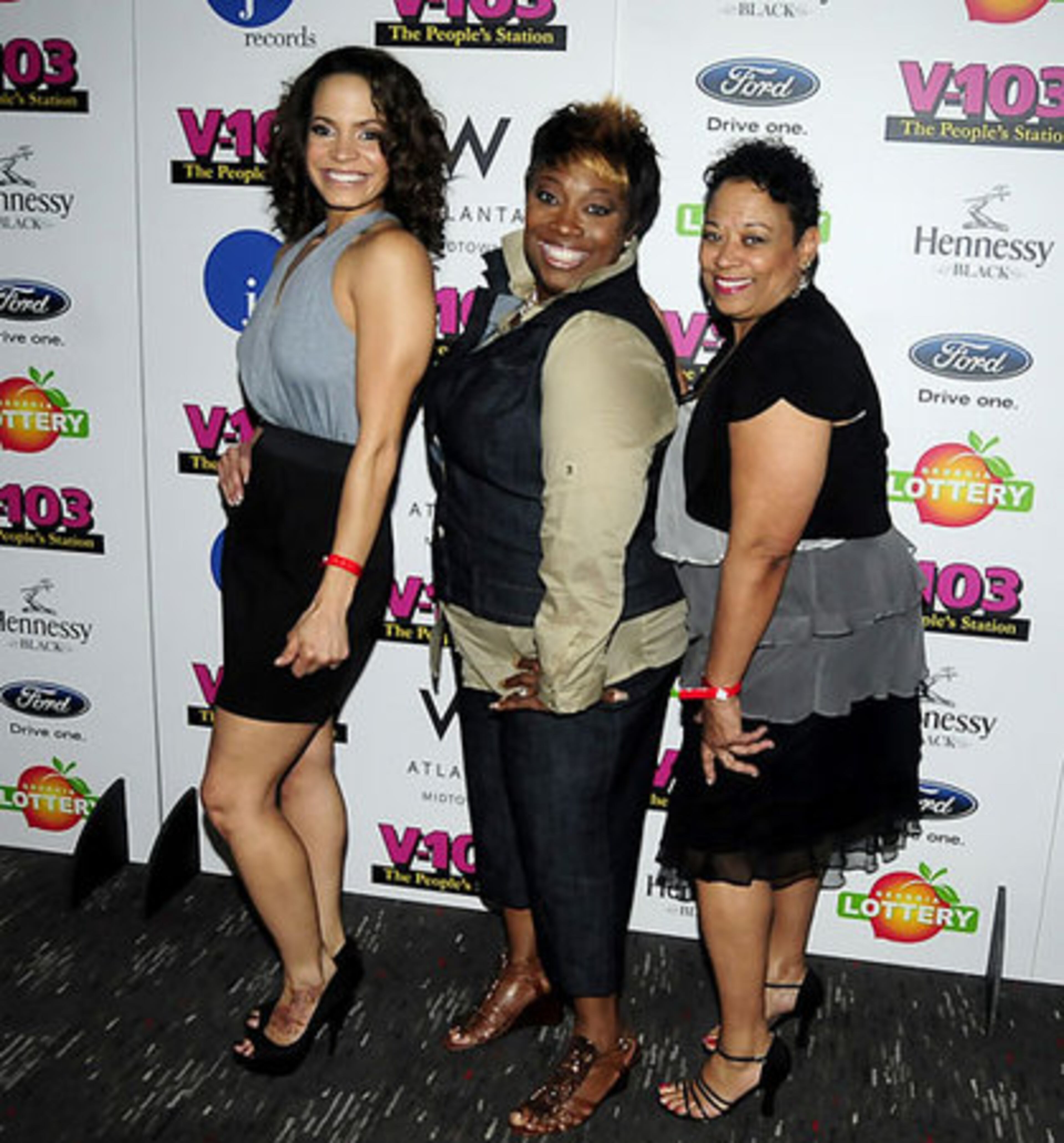 V-103 DJ's Ellie Duncan and Wanda Smith pose with news director Jean Ross.