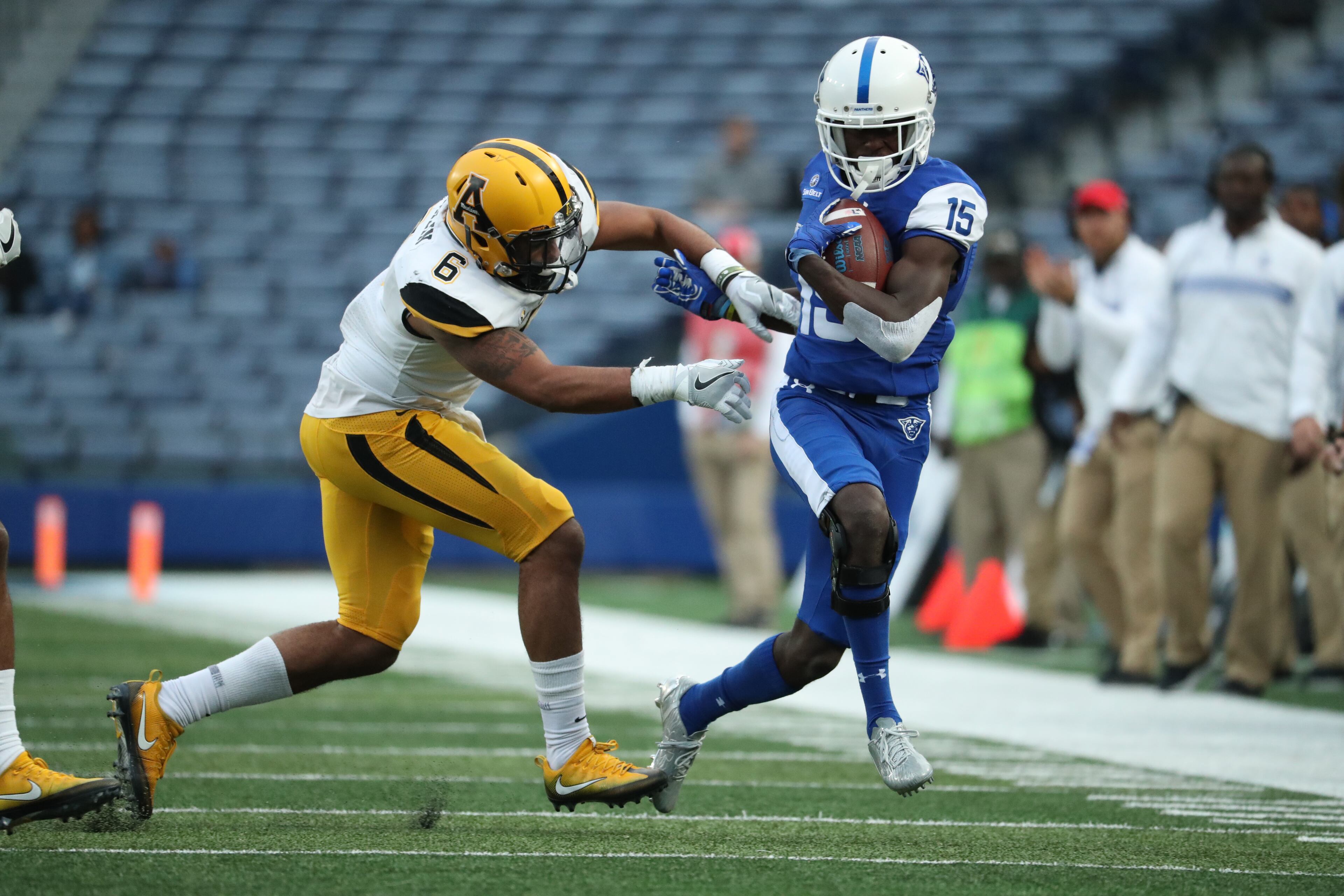 November 25, 2017 - Atlanta, Ga: Georgia State Panthers wide receiver Todd Boyd (15) is pushed out of bounds by Appalachian State Mountaineers defensive back Desmond Franklin (6) in the second half of their game at GSU Stadium Saturday, November 25, 2017, in Atlanta. Appalachian State Mountaineers won 31-10. PHOTO / JASON GETZ