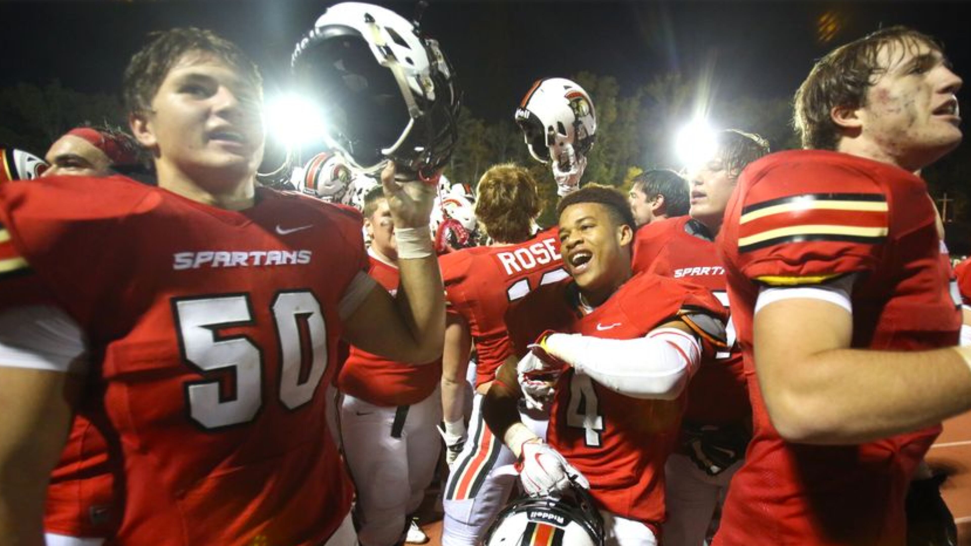 October 30, 2015 - Norcross, Ga: GAC linebacker Aiden Jarrett (50) and running back Marcus Young (4, center) celebrate their win over Lovett at Greater Atlanta Christian Friday in Norcross, Ga., October 30, 2015. GAC won 34-7. PHOTO / JASON GETZ