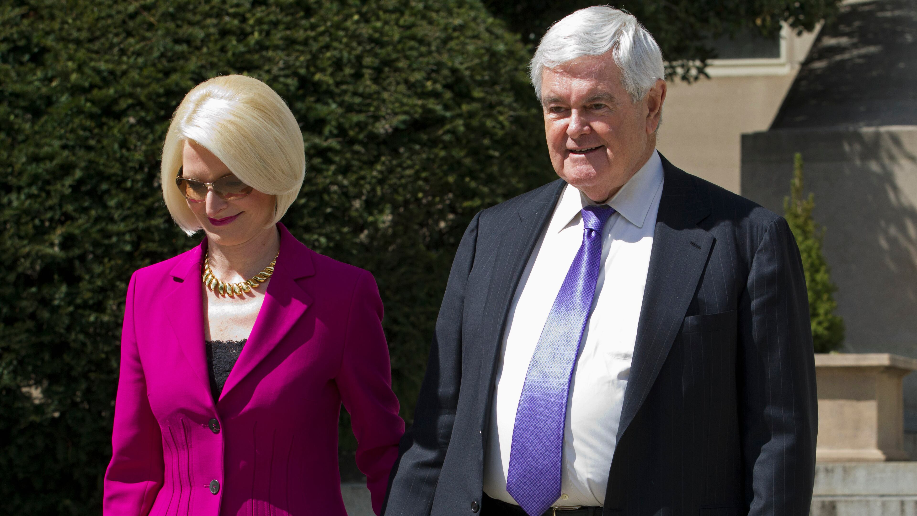 Former House Speaker Newt Gingrich and his wife Callista leave a closed-door meeting with Republican presidential candidate Donald Trump in Washington, Monday, March 21, 2016. (AP Photo/Jose Luis Magana)