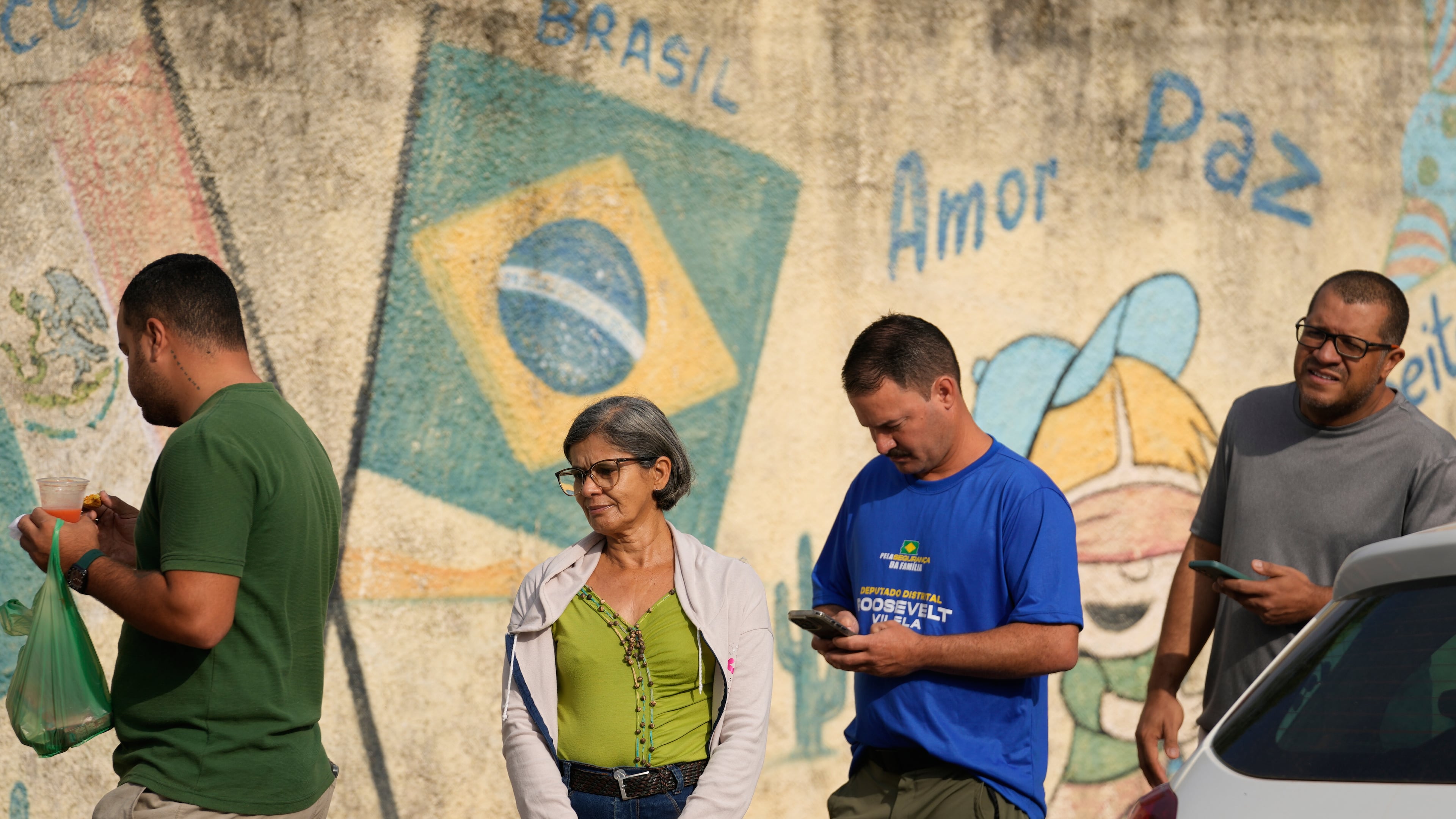 Voters line up at a polling station during general elections in Brasilia, Brasilia, Sunday, Oct. 4, 2026. (AP Photo/Eraldo Peres)