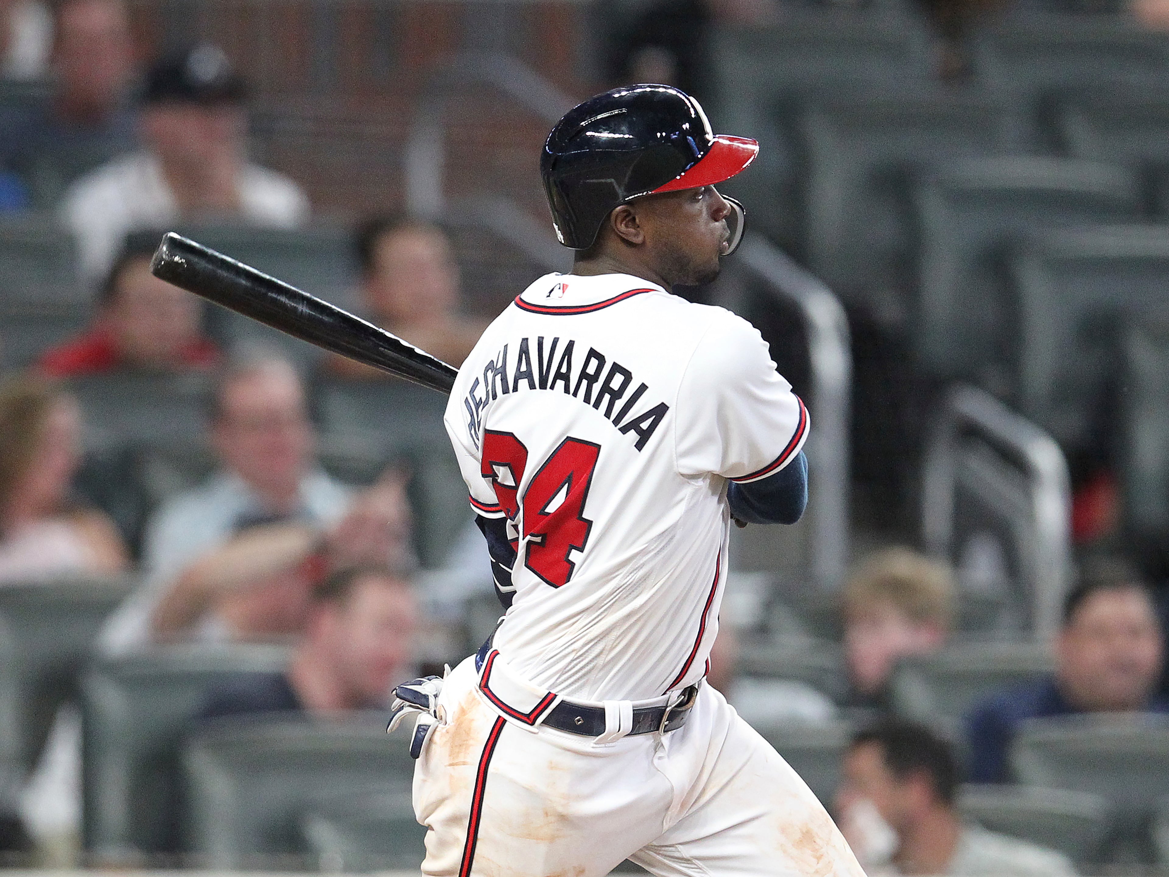 Atlanta Braves' Adeiny Hechavarria hits a double against the Miami Marlins during the ninth inning of a baseball game Thursday, Aug. 22, 2019, in Atlanta. (AP Photo/Tami Chappell)