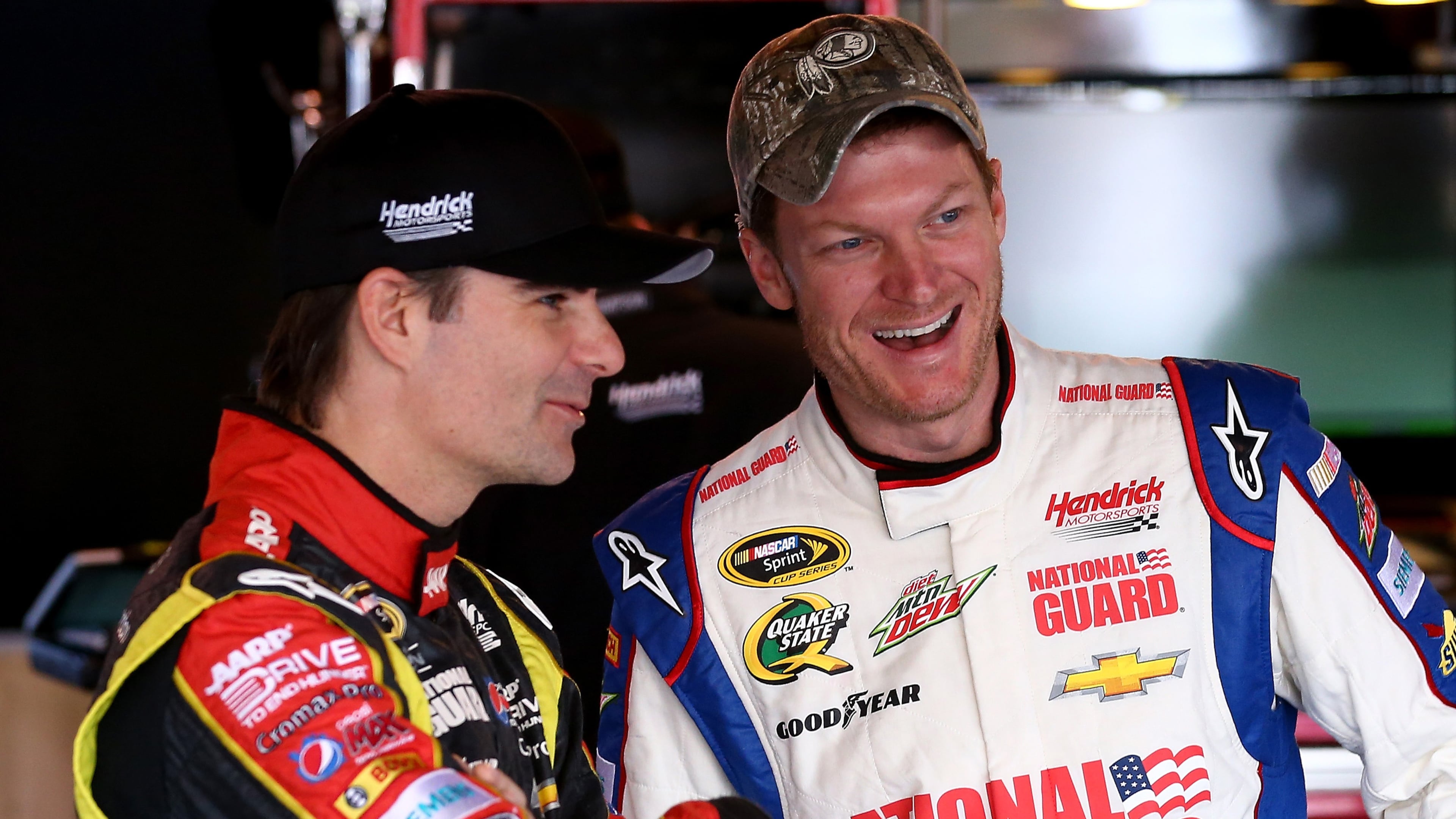 MARTINSVILLE, VA - OCTOBER 26: Jeff Gordon(L), driver of the #24 Drive To End Hunger Chevrolet, and Dale Earnhardt Jr., driver of the #88 National Guard Chevrolet, talk in the garage area during practice for the NASCAR Sprint Cup Series Goody's Headache Relief Shot 500 Powered By Kroger at Martinsville Speedway on October 26, 2013 in Martinsville, Virginia. (Photo by Streeter Lecka/Getty Images)