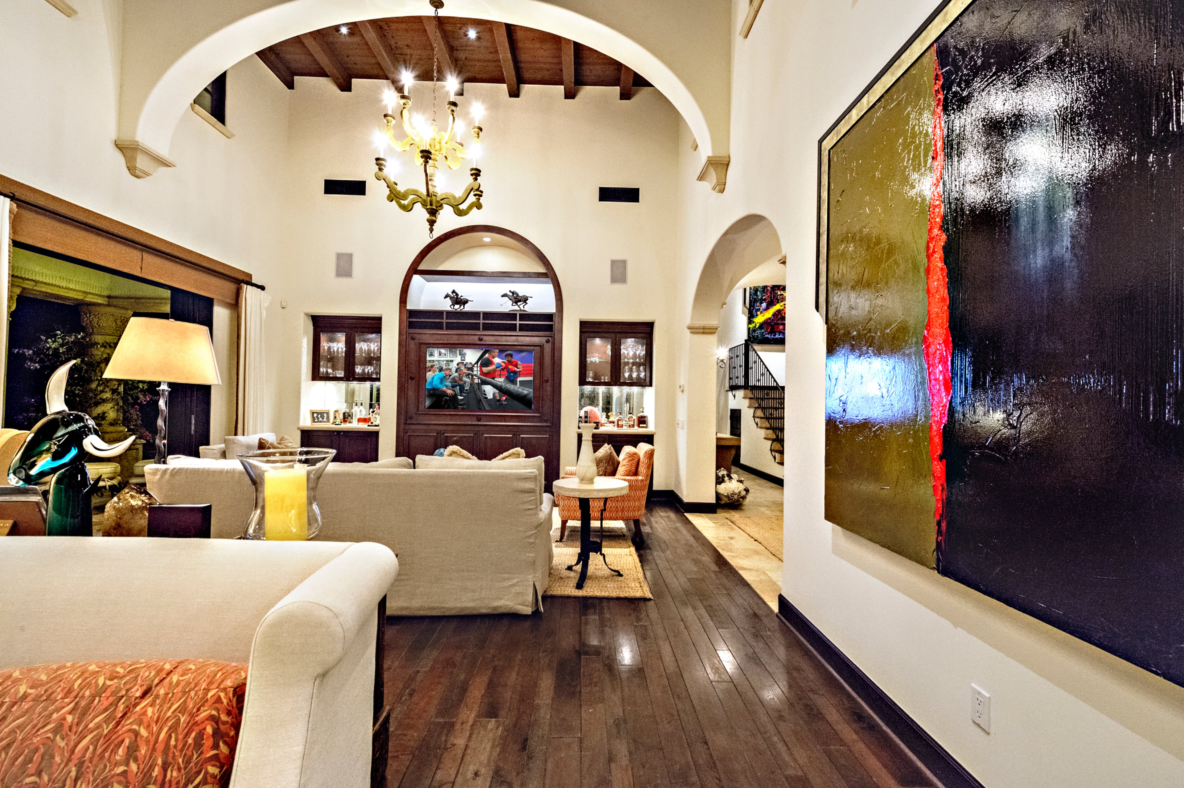 This Golden Globe winning movie star's villa is the ultimate retreat from fast paced Hollywood living. Offered feng shui custom designer furnished. Rocky star and all-around action movie legend Sylvester Stallone has put his desert home in a gated La Quinta, Calif., community up for sale at $4.2 million. The 5,173-square-foot, four-bedroom, 4.5-bathroom home features details such as arched doorways, exposed beams, and plenty of space to hang his paintings, since he’s not just an actor—he’s an artist, too. Listing courtesy of Josh Reef, Hurwitz James Company