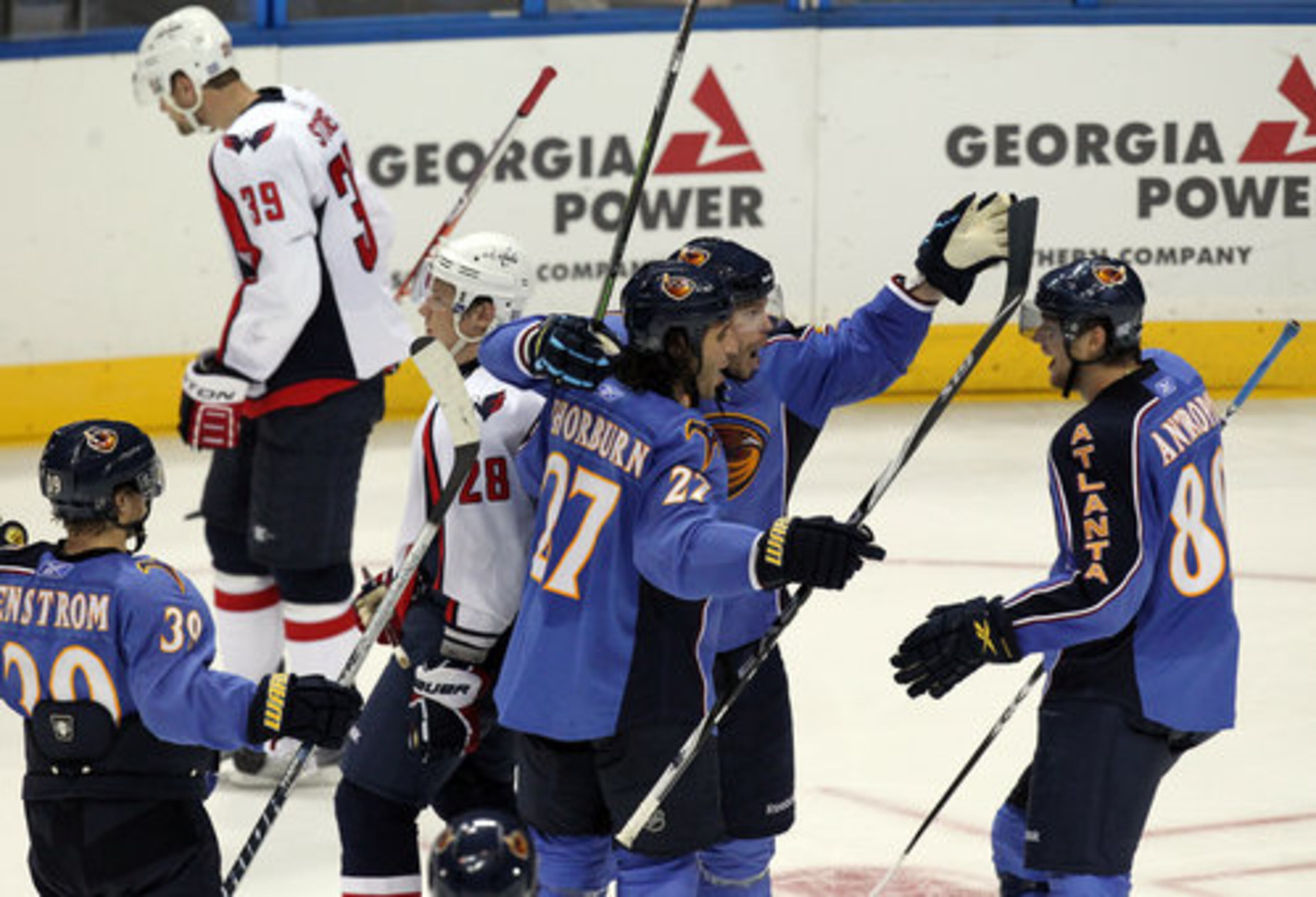 The Atlanta Thrashers celebrate beating the Washington Capitals 4-2 to win their 2010-11 season opener at Philips Arena in Atlanta on Friday, Oct. 8, 2010.