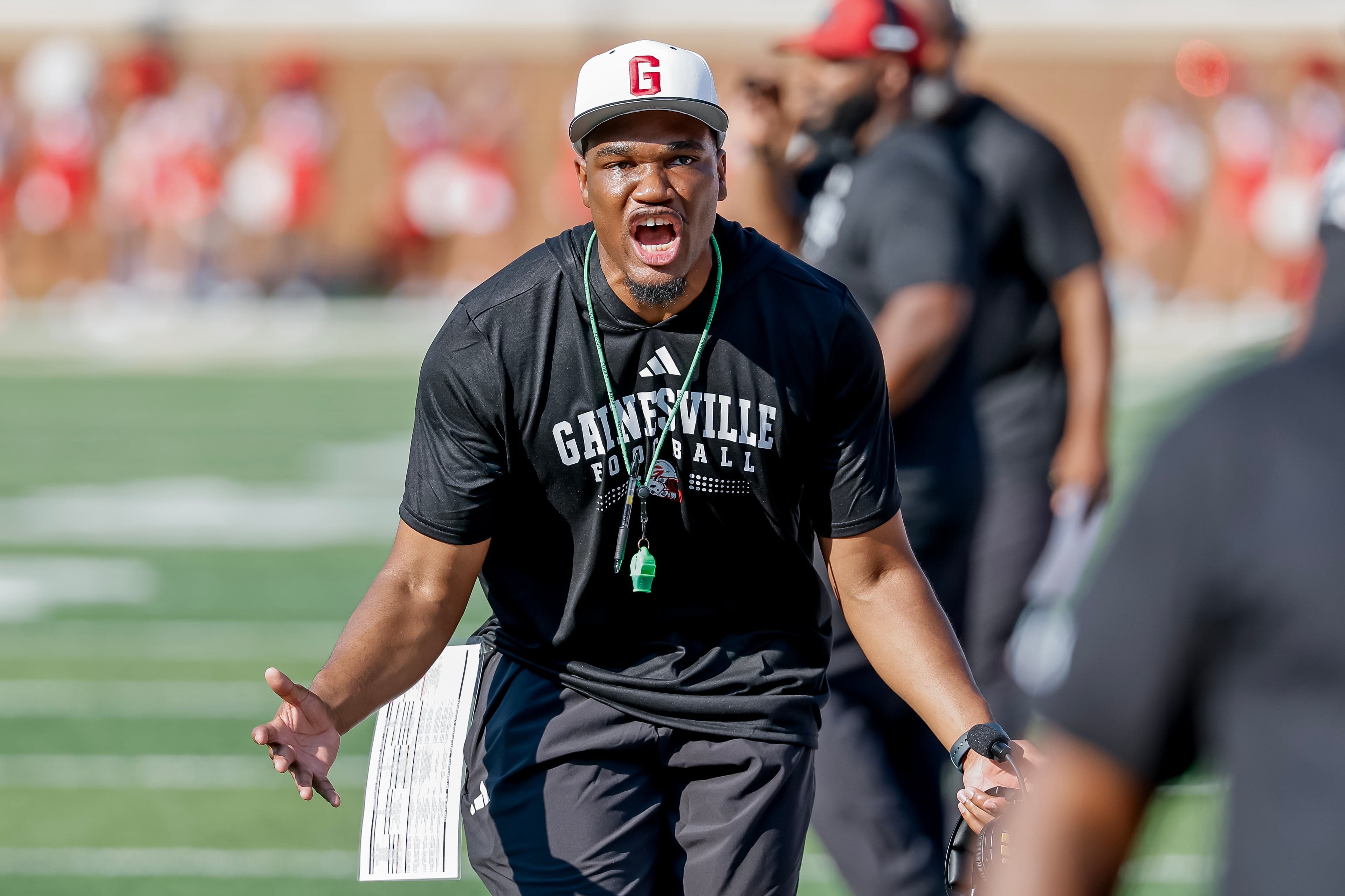 Gainesville head coach Santavious Bryant reacts during the first half of a high school football game between Buford and Gainesville, Saturday, Aug. 22, 2026, in Buford, GA. (Erik S. Lesser for the AJC)